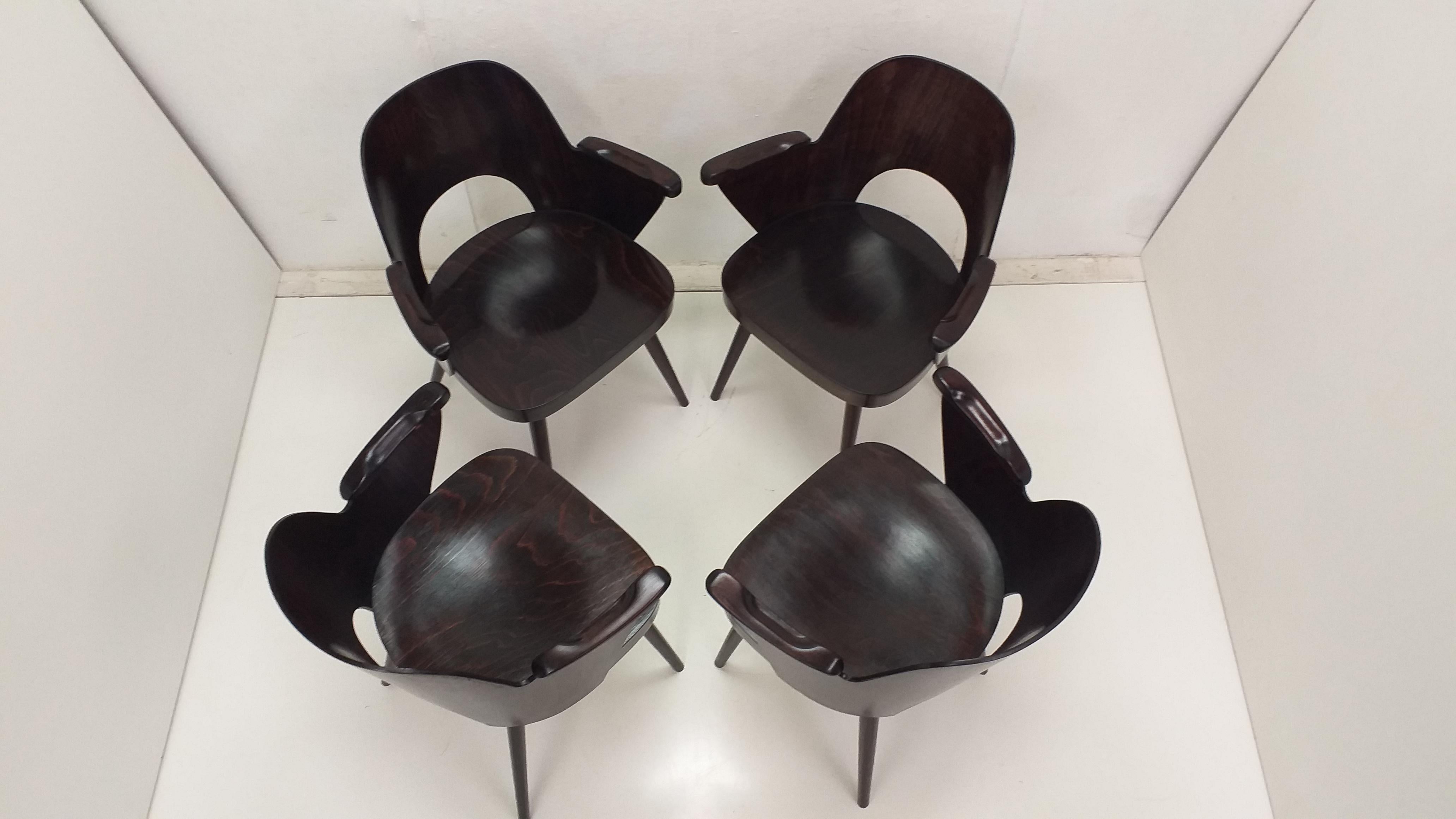 -	4 pieces of wooden chairs with armrests after a complete renovation
-	new shellac polish
-	Design by Oswald Haerdtl 1950
-	production Ton Bystřice pod Hostýnem Czechoslovakia

