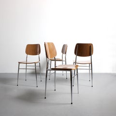Set of 4 chairs with chromed metal frames and laminated wood seats and backs -