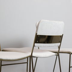 Set of 4 chairs with gold-plated metal frames and white chenille upholstery