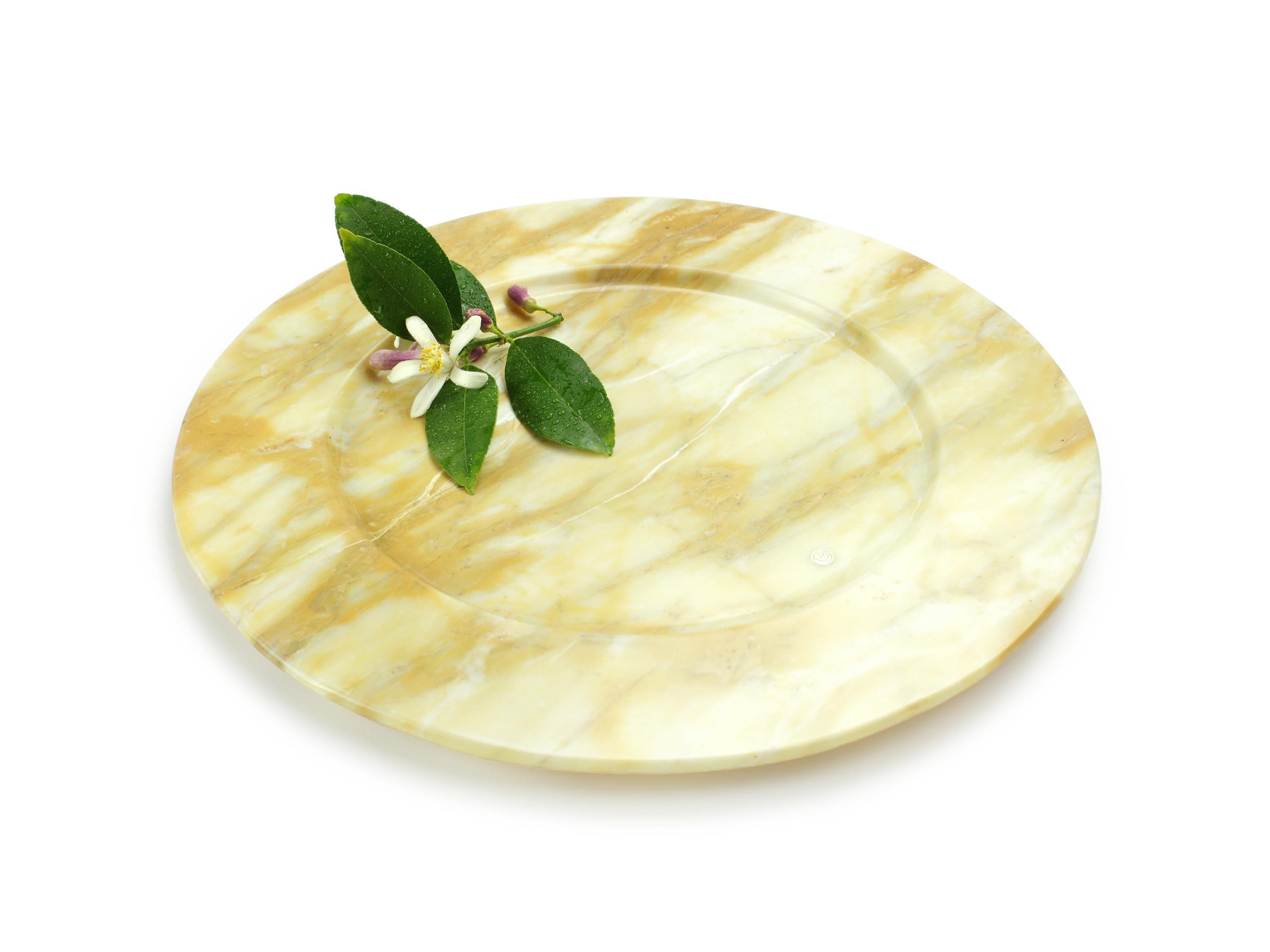 Set of 4 hand carved charger plates from Yellow Siena marble. Multiple use as charger plates, plates, platters and placers. 

Dimensions: D 33, H 1.9 cm. Available in different marbles, onyx and quartzite. 

100% Hand made in Italy. 

Marble is a