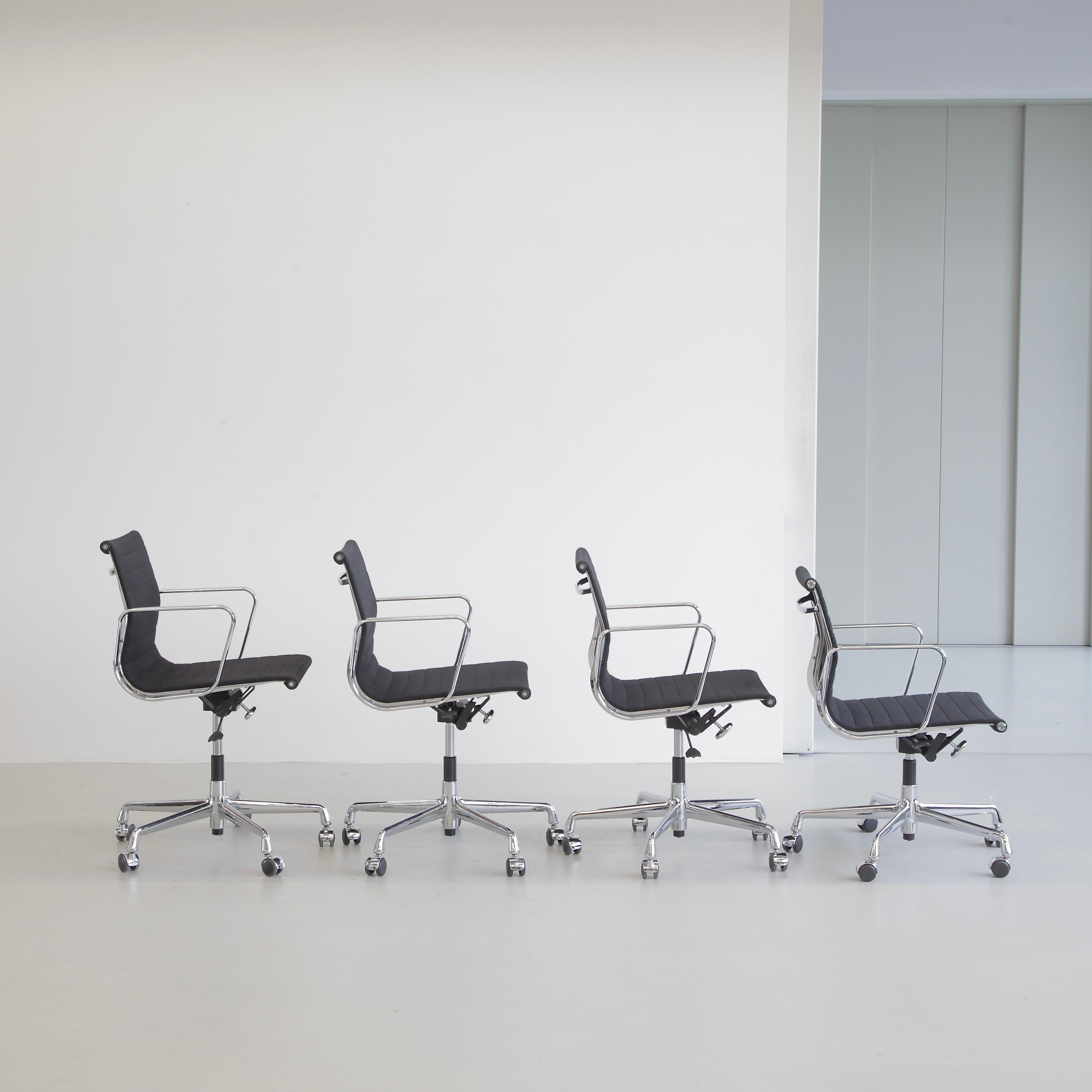 Aluminium Office Chairs designed by Charles and Ray Eames. Germany, VITRA, c2018.

A beautiful set of black hopsack height adjustable chairs with chromed aluminium rotating 