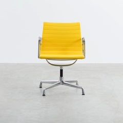 Set of 4 Charles & Ray Eames Aluminum Group EA107 Chairs in Yellow fabric, Vitra
