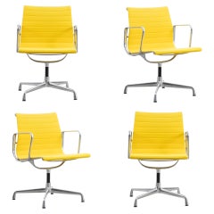 Set of 4 Charles & Ray Eames Aluminum Group EA107 Chairs in Yellow fabric, Vitra