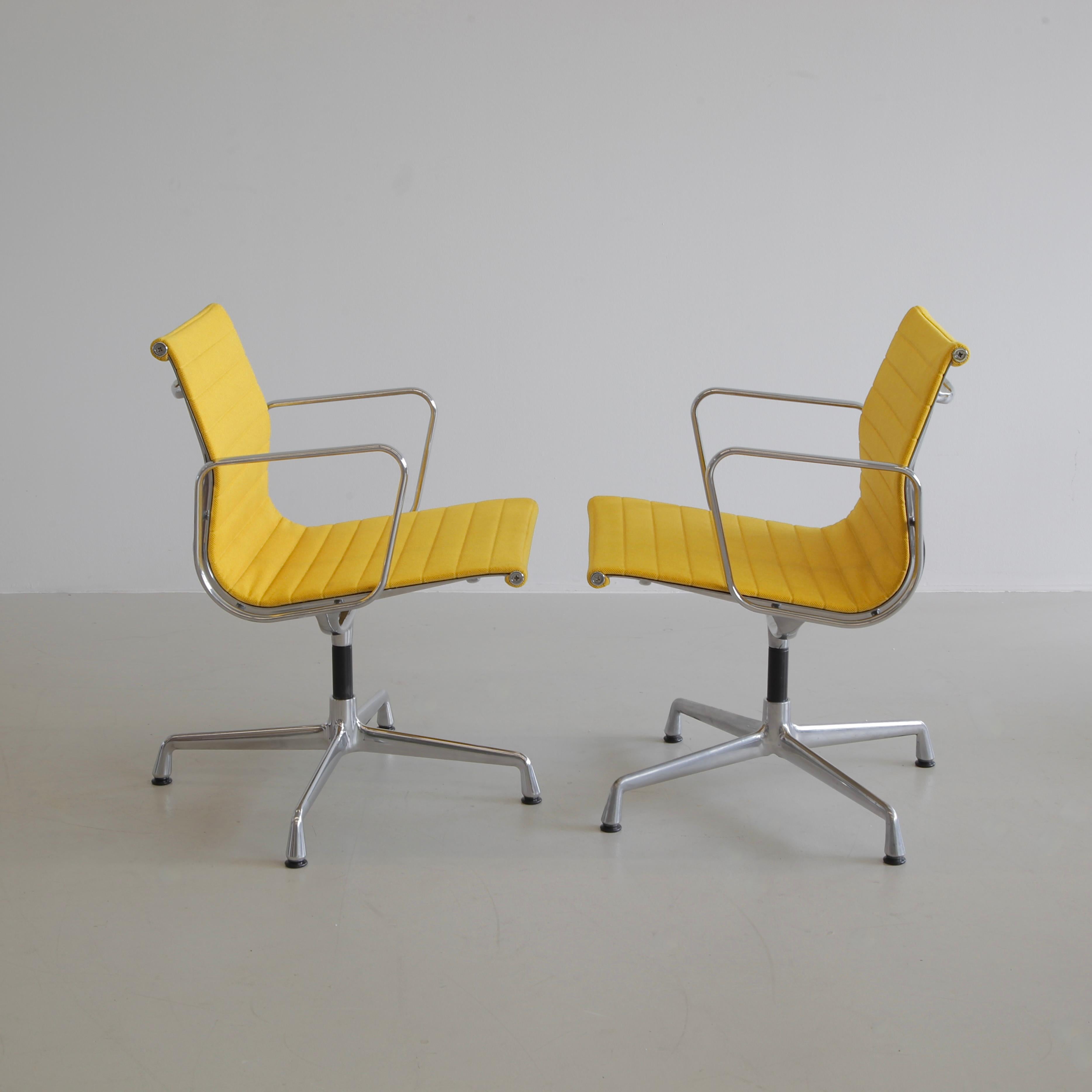 Aluminium office chairs designed by Charles and Ray Eames. Germany, VITRA, dates vary on the base.

A beautiful set of yellow hopsack and chromed aluminium rotating chairs with armrests. Best colour ever!

