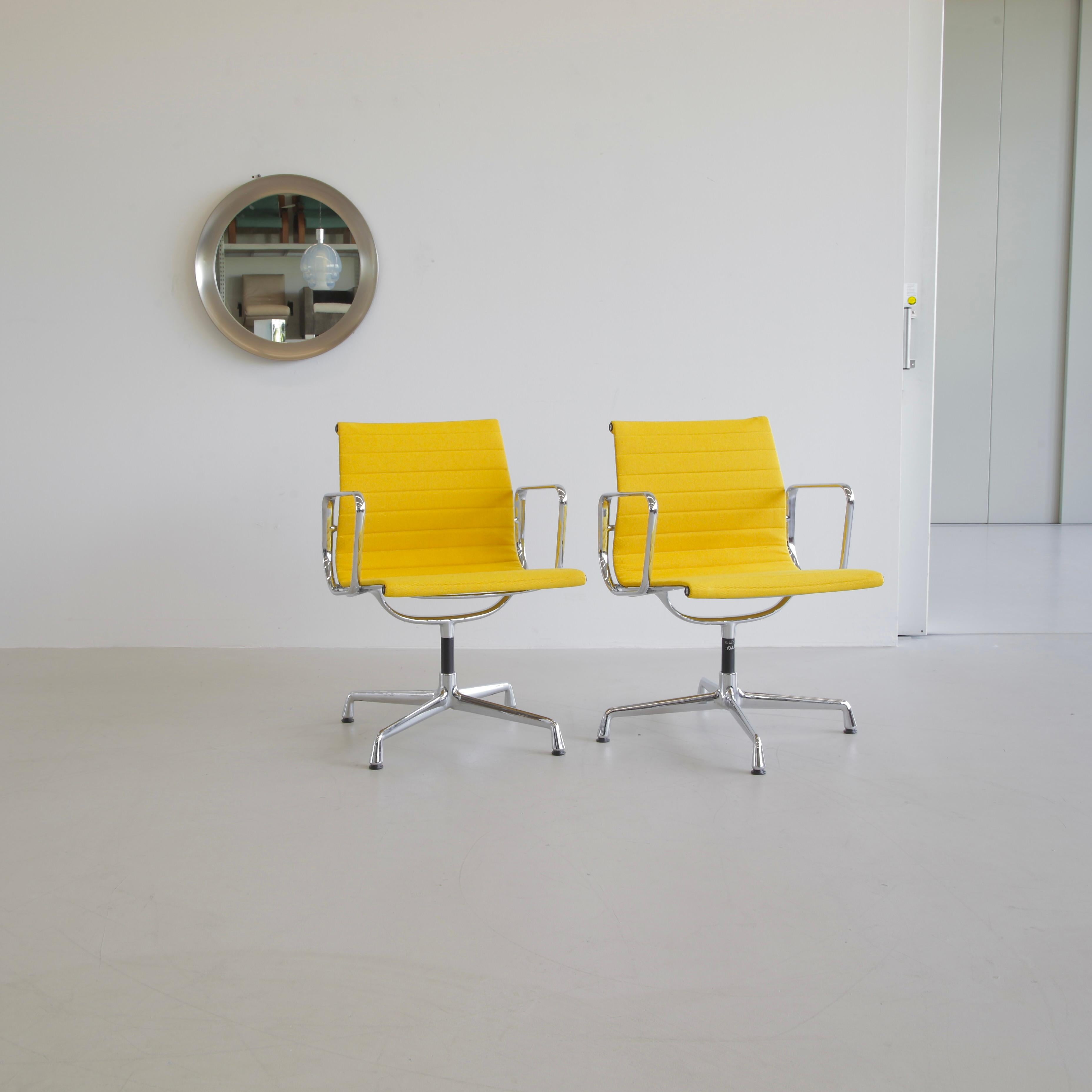 Aluminium office chairs, designed by Charles and Ray Eames. Germany, VITRA, dates vary on the base.

A beautiful set of yellow hopsack and chromed aluminium rotating chairs with armrests. Best colour ever!

