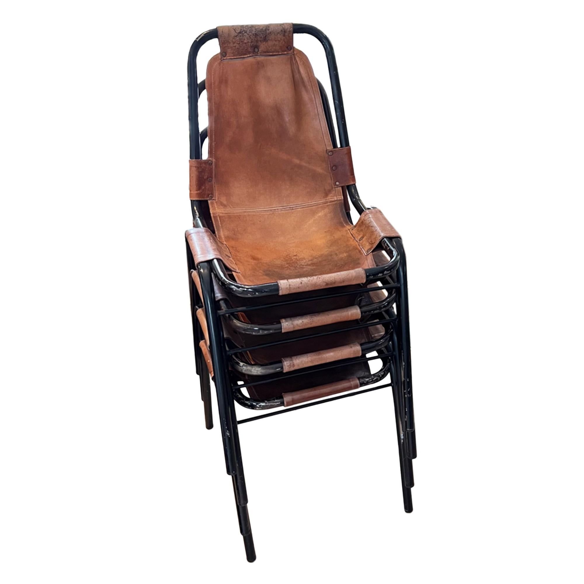 This is a great set of stacking chairs - the style was selected by the French architect and designer Charlotte Perriand in the 1960s for the Alpine ski resort of Les Arcs. 
They are in the style of DalVera.

Made from tubular steel and leather, the