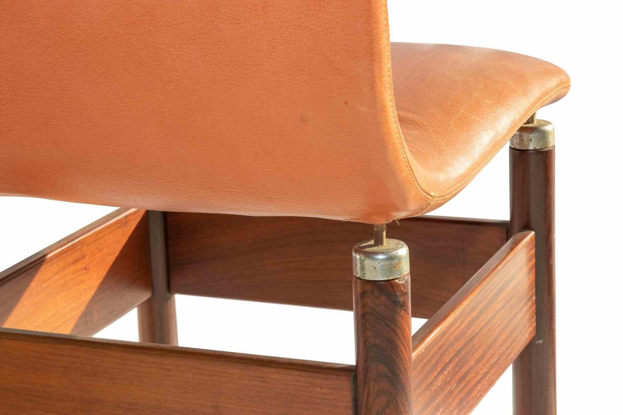Chelsea Chair is a design furniture item realized by Vittorio Introini for Saporiti in 1966.

Solid wood structure with leather seat.

Rare and in good condition, with just minor signs of age.
 