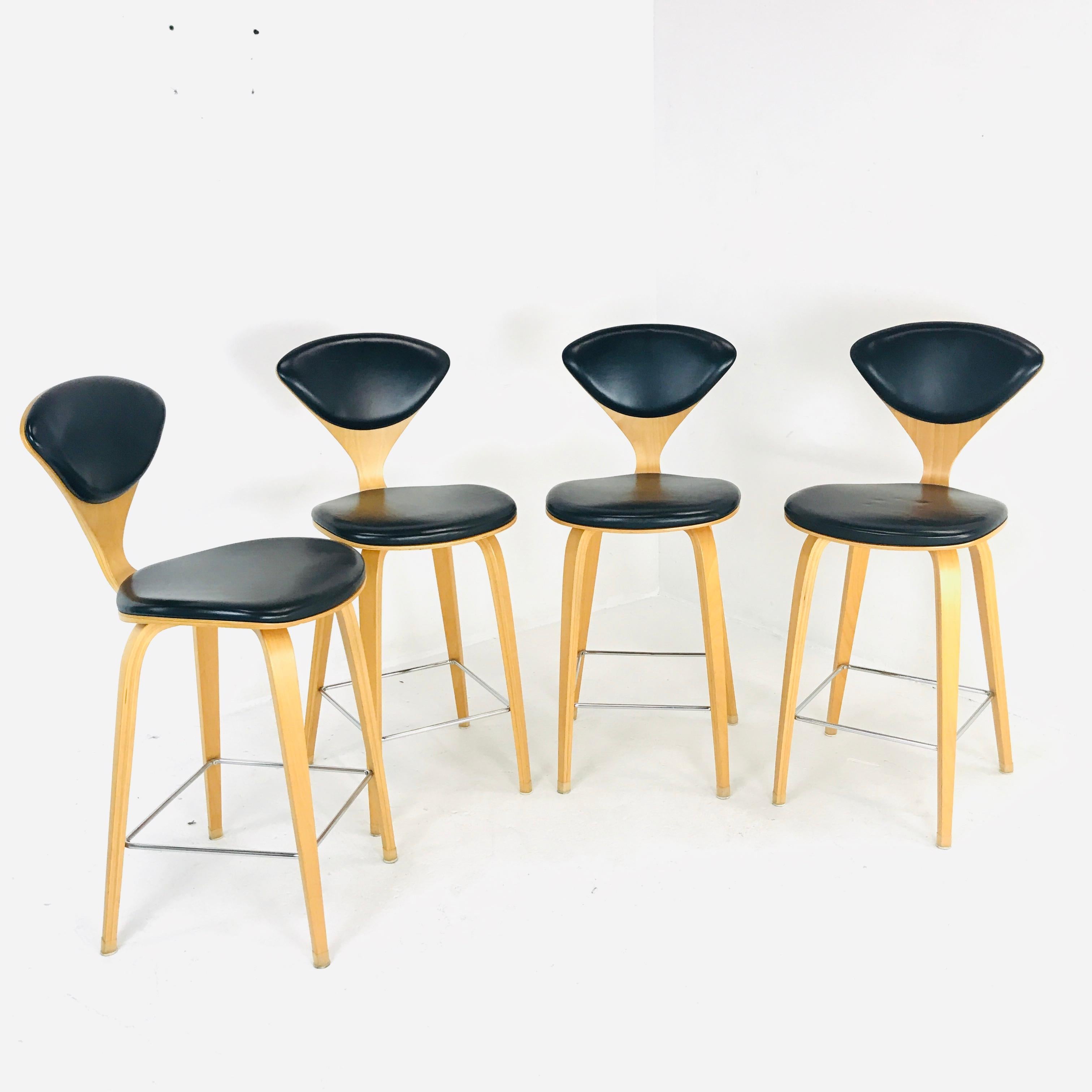 This upholstered stool by Cherner Chair Company is one piece that never goes unnoticed by your guests. The timeless design displays a molded triangular backrest and curved seat with a slim waist. It rests on brilliantly shaped, sharp-edged legs with