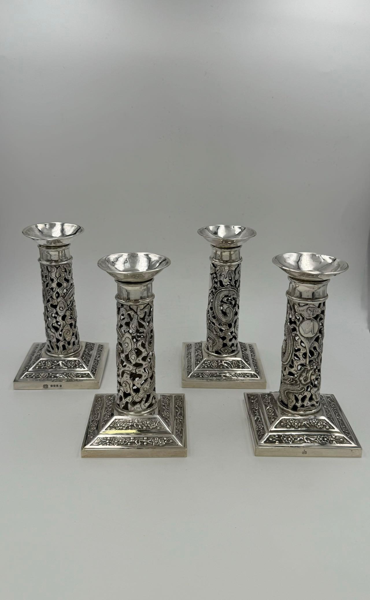 A Set of 4 Chinese Export Silver Candlesticks with Glasgow import marks for the firm of George Edward & Sons, 1899. The Scottish firm was one of the few UK companies that stocked Chinese and Japanese silver, and pieces with their import mark are