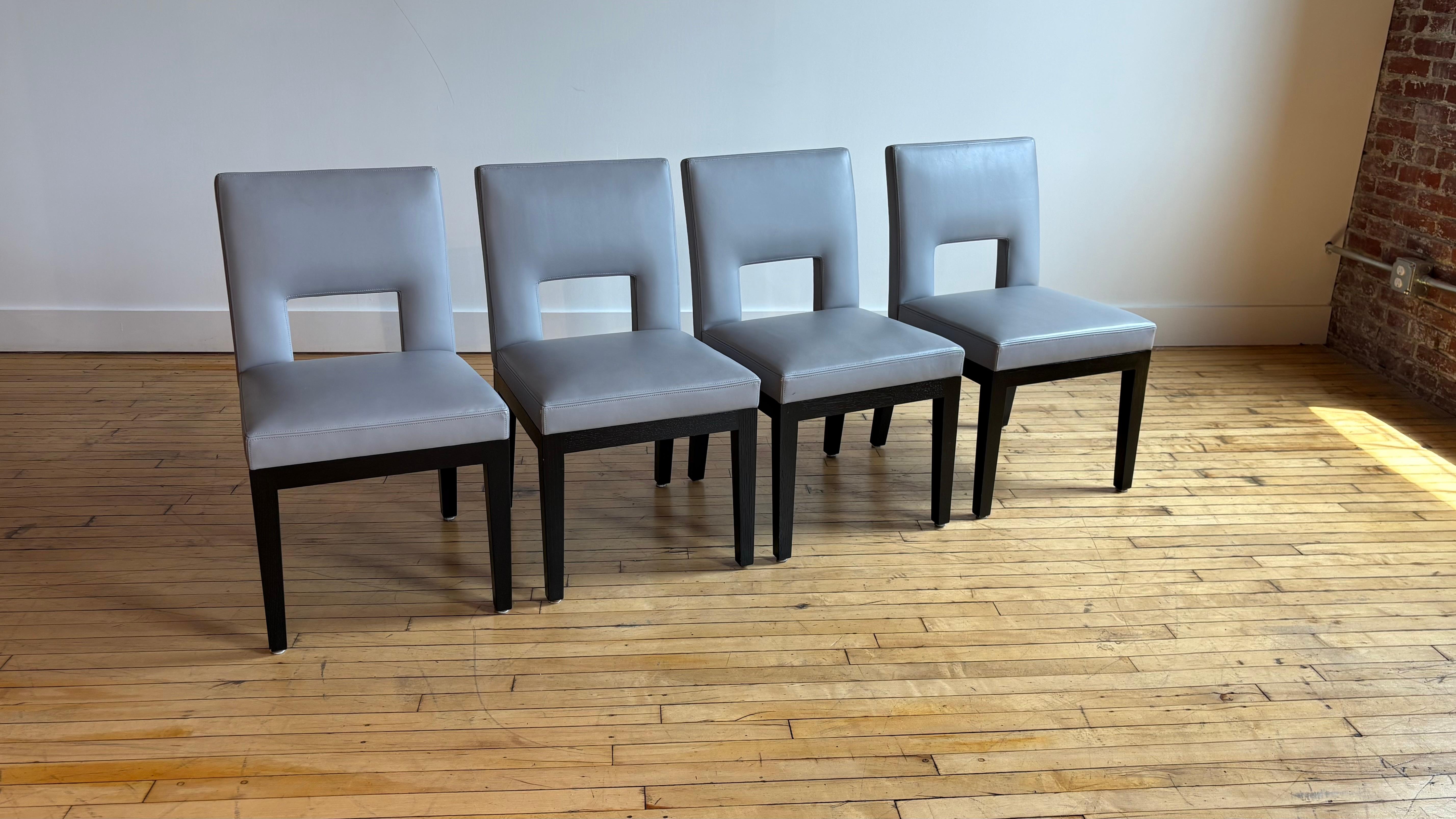 Beautiful set of four Christian Liaigre blue/grey leather chairs. 

We also have the matching banquette and a Liaigre dining table. 

Very good condition. Purchased in 2012 from the Liaigre NYC showroom. 

We have the largest selection of secondhand