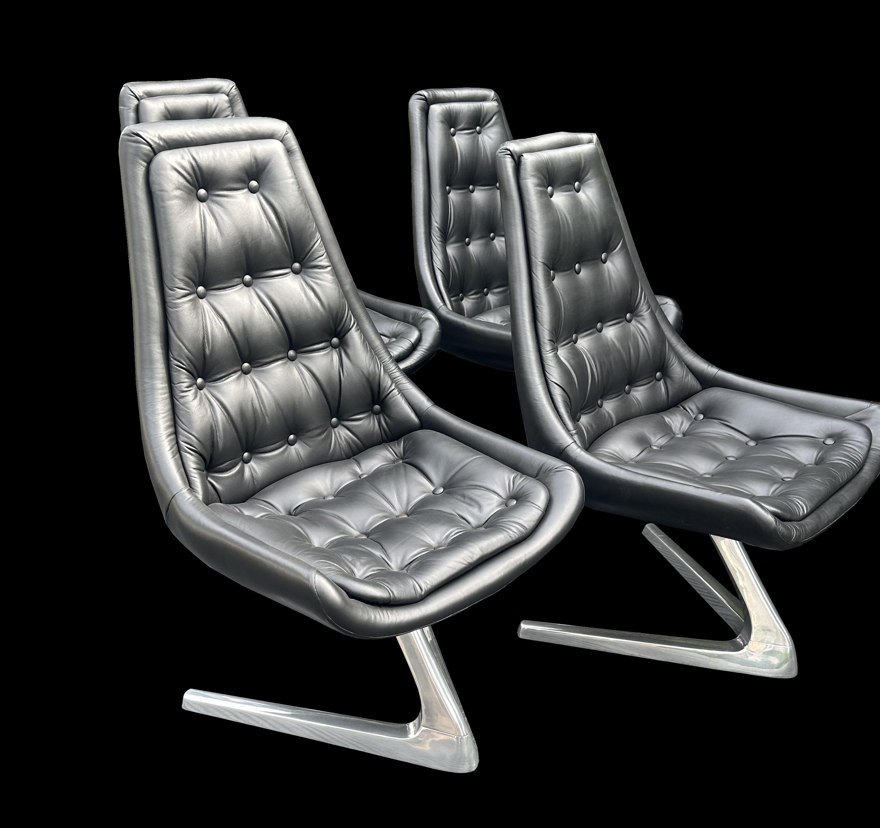 An original set of 4 Chromcraft Sculpta self centering swivel chairs in Black leather and polished aluminium, as seen in the original series of Star-Trek in the episode 'The trouble with Tribbles' (a still shot shown in the images of the