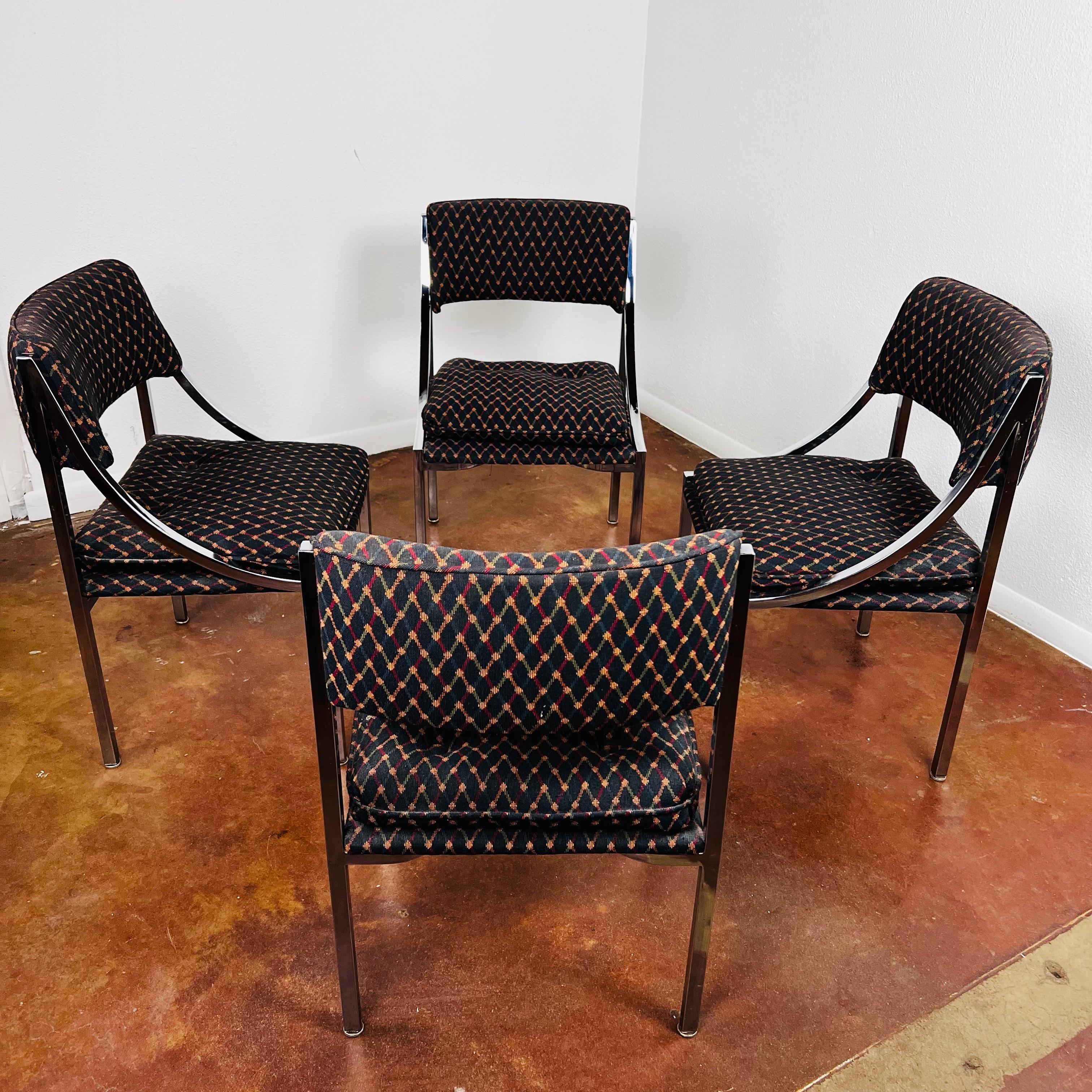 Fabulous set of 4 vintage dining chairs by Wolfgang Hoffmann for Howell Co. Flat chromium plated steel frames support upholstered seats and back. Clean upholstery, some signs of wear due to age and use but no rips, stains, tears, or rust. 
Seats