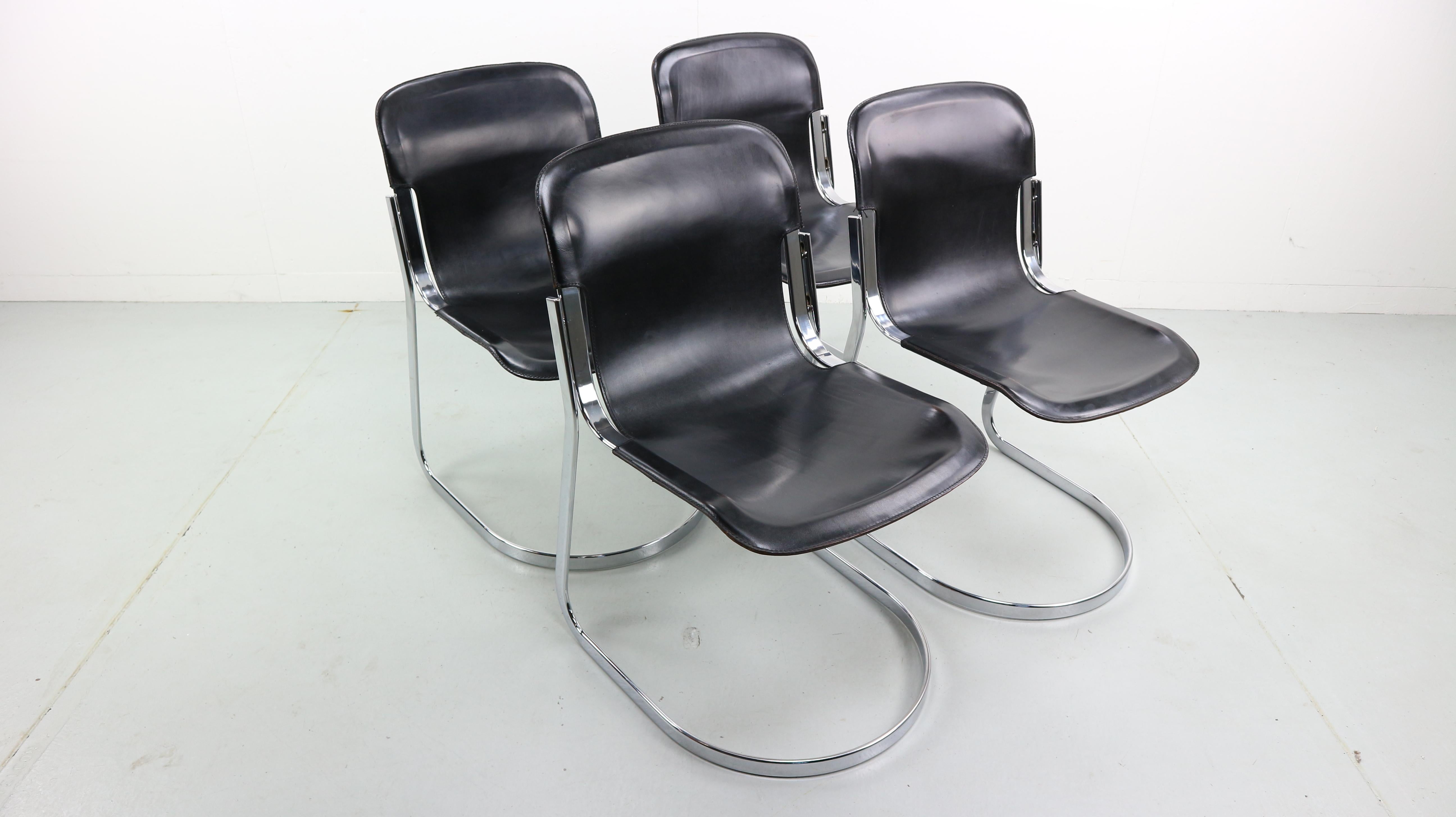 Set of four Italian Cidue dining chairs (model C2) from the 1970s designed by Willy Rizzo. These cantilever chairs have a flat chromed tubular steel frame and are covered with high quality black saddle leather.