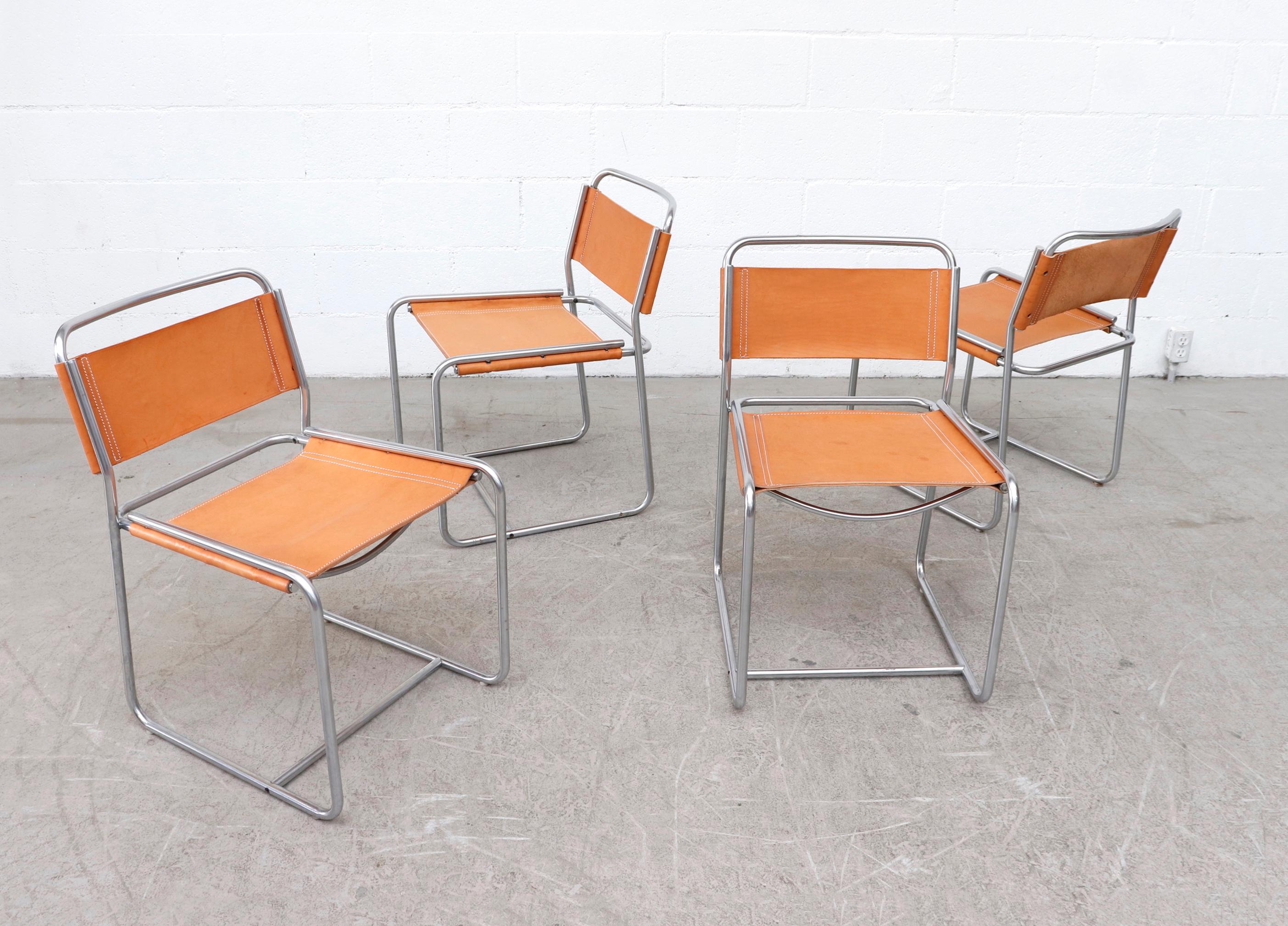 Beautiful set of 4 Claire Bataille and Paul Ibens Model 'SE18' dining chairs with nickel-plated tubular metal frames and new natural leather seats. In original condition with some wear to frame consistent with their age and use. Set price. Other