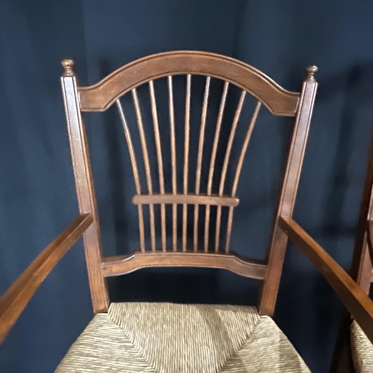 Super high quality set of 4 classic Italian rush seat walnut chairs with intricate splayed spindle backs and H stretchers. Beautiful floral pattern on apron and on tops of turned legs. Sturdy and comfortable. Seat height 18.5
#3525.