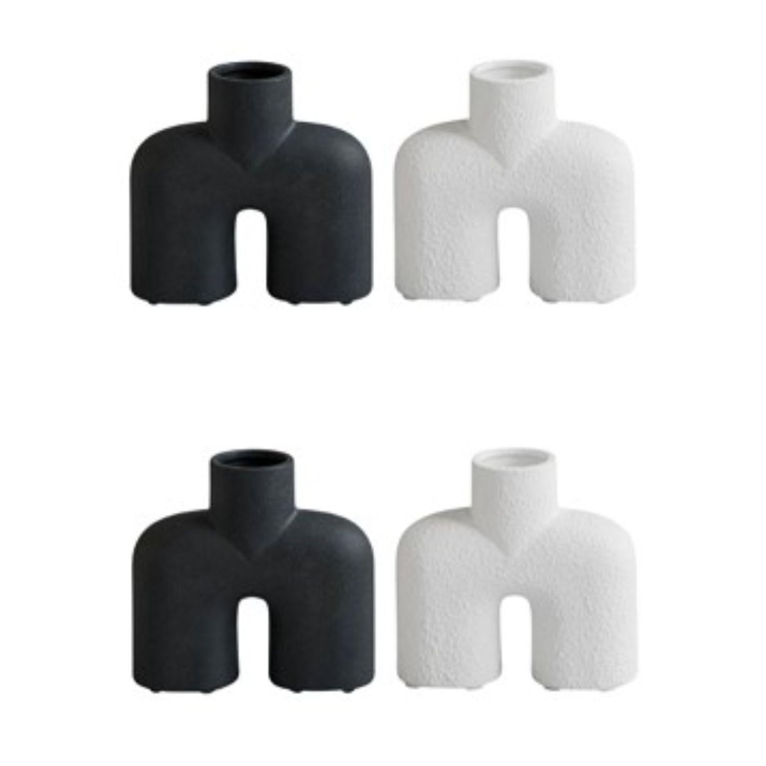 Set of 4 Cobra Uno Mini by 101 Copenhagen
Designed by Kristian Sofus Hansen & Tommy Hyldahl
Dimensions: L18 / W6,5 / H16,5 CM
Materials: Ceramic

A tribute to the Cobra Arts Movement of the 1960s, the collection is the epitome of quirky vases