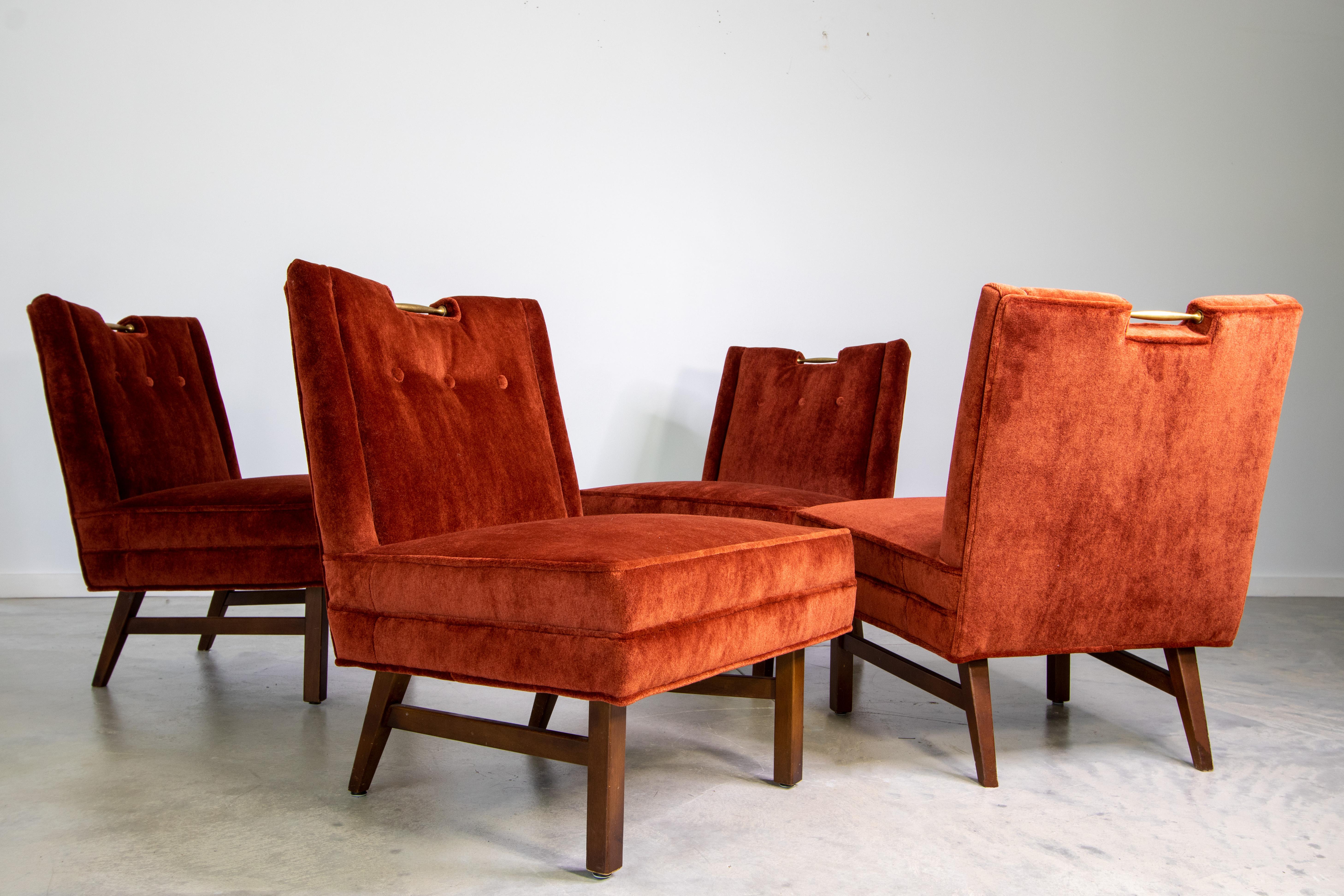 A set of four cocktail slipper chairs designed by Merton Gershun for American of Martinsville. These have often been attributed to Harvey Probber, but we were able to locate an original advertisement accrediting the correct designer. These chairs