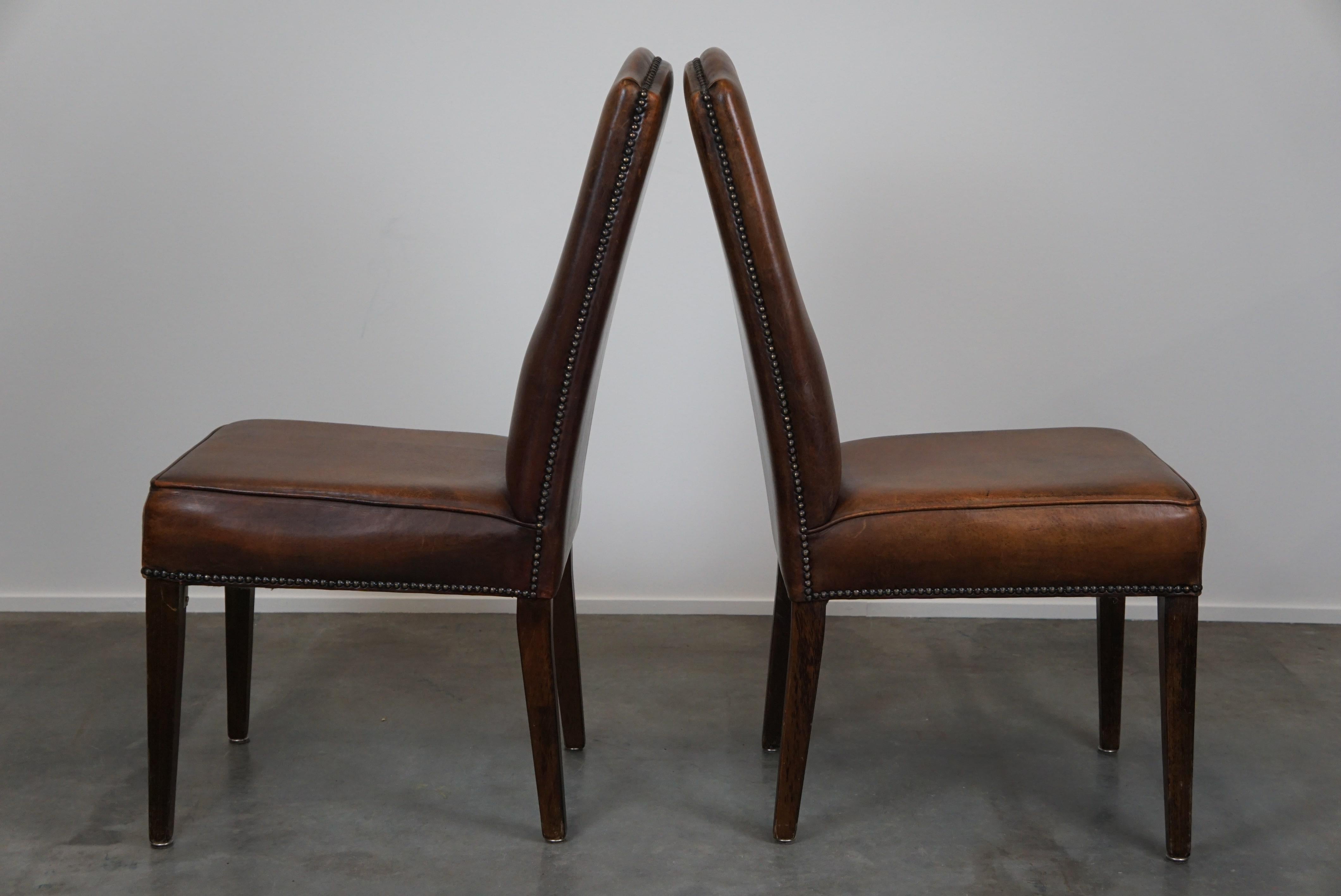 Leather Set of 4 cognac-colored sheep leather dining chairs with a beautiful patina For Sale