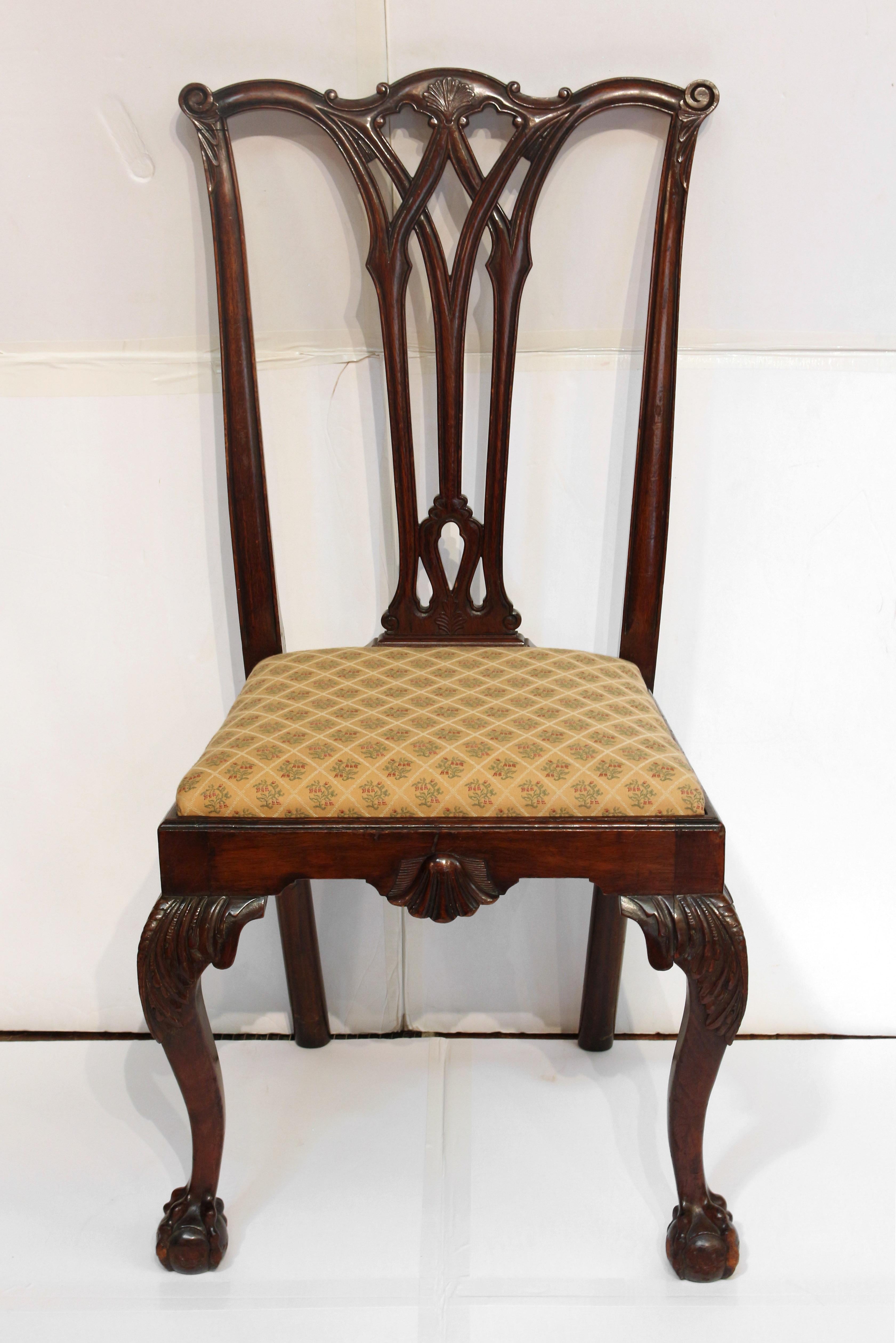 Circa 1900 Set of 4 Dining Chairs, Colonial Revival, Philadelphia form. All sides; mahogany. Richly developed with Gothic influenced back splats, cabriole legs with ball & claw feet, carved kneed & shell carved apron. 21