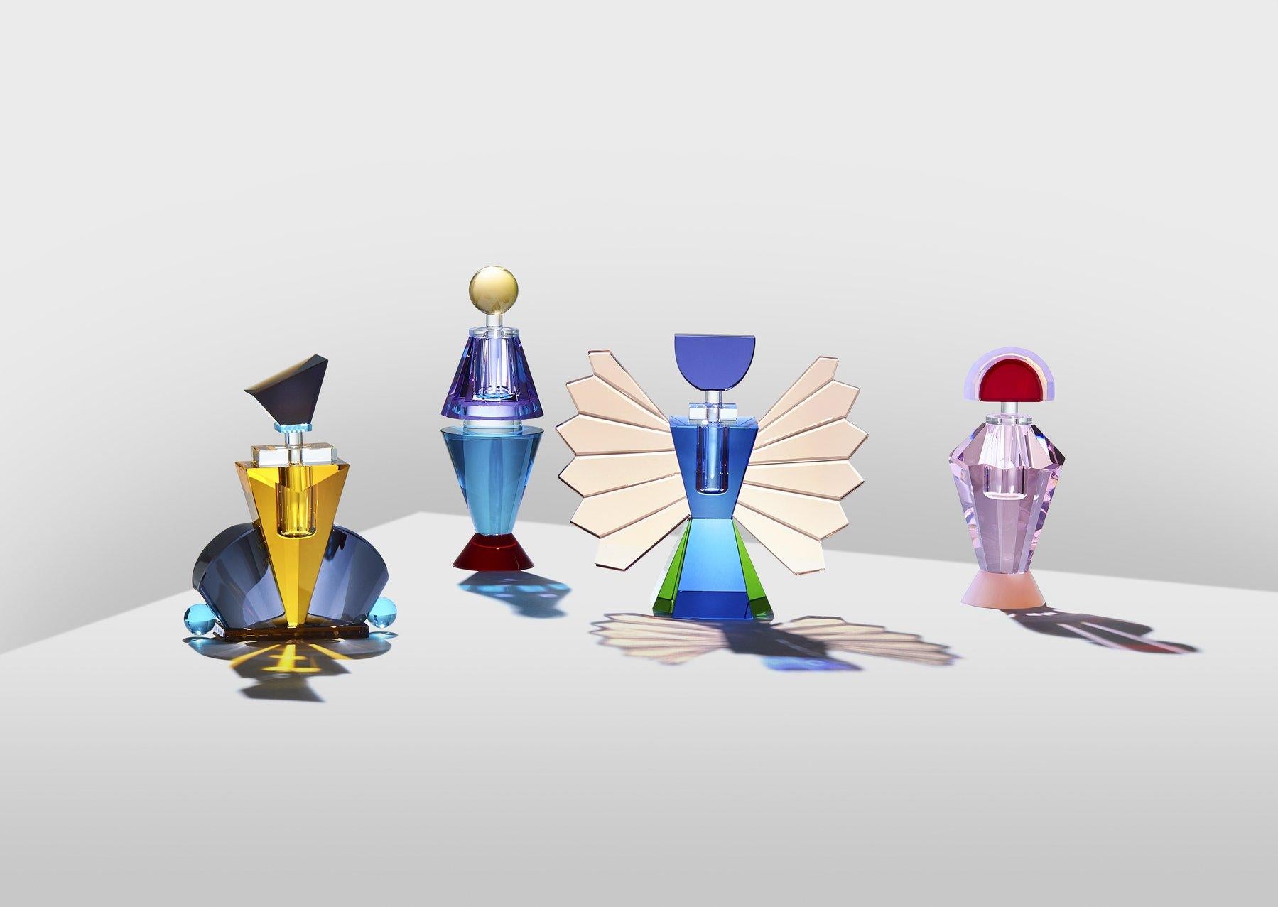 Set of 4 colorful crystal perfume flacons, hand-sculpted contemporary crystal.
Hand-sculpted in crystal
Measures: Small:
Height 17.5 cm
Width 20 cm
Depth 7.5 cm
Weight: 1.2 kg
Material: Fine handcut crystal.

The collection has 4 fine
