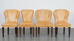 Set of 4 comfortable honey-colored goat leather dining chairs in good condition
