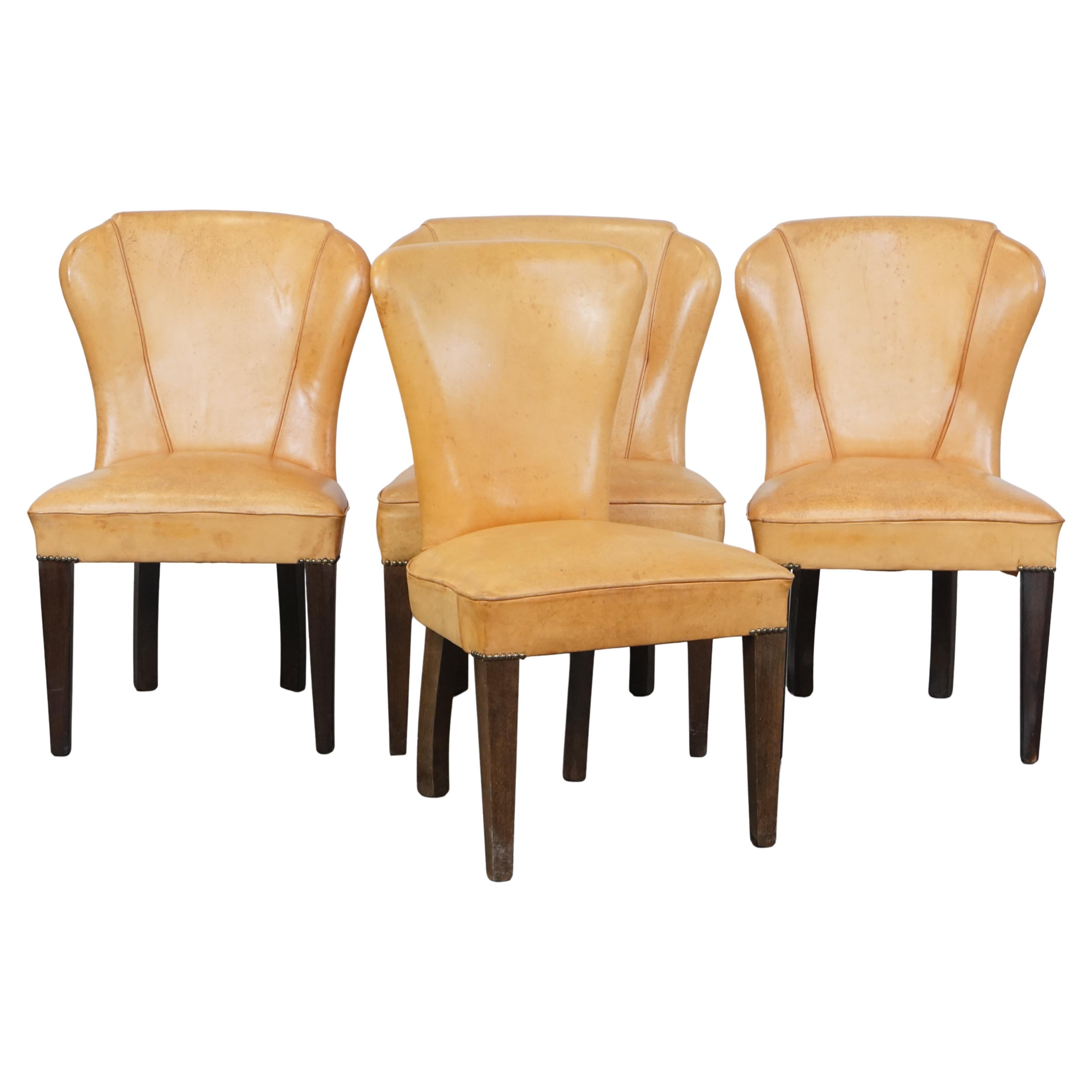 Set of 4 comfortable honey-colored goat leather dining chairs in good condition