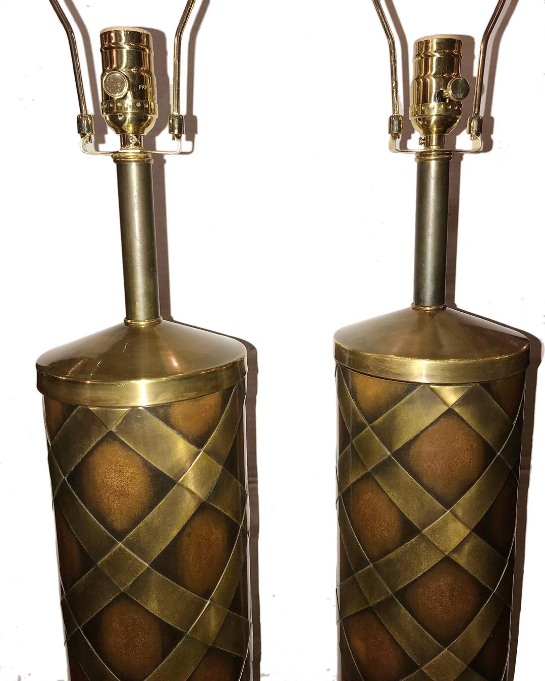 A pair of circa 1950s Italian copper table lamps with brass details on body. 

Measurements:
Height of body: 23