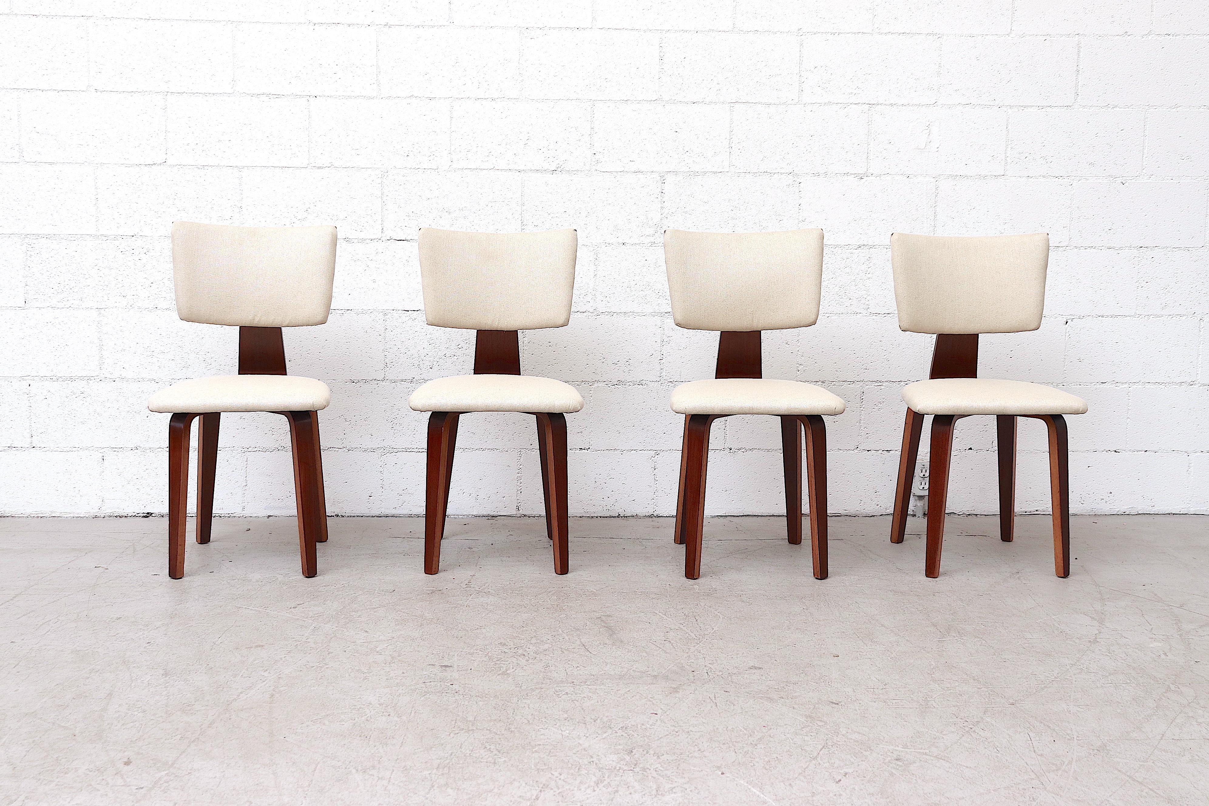 Beautiful set of 4 Cor Alons dining chairs with lightly refinished mahogany frames and freshly reupholstered white fabric seats. In original condition with some wear consistent with age and use. Set price.