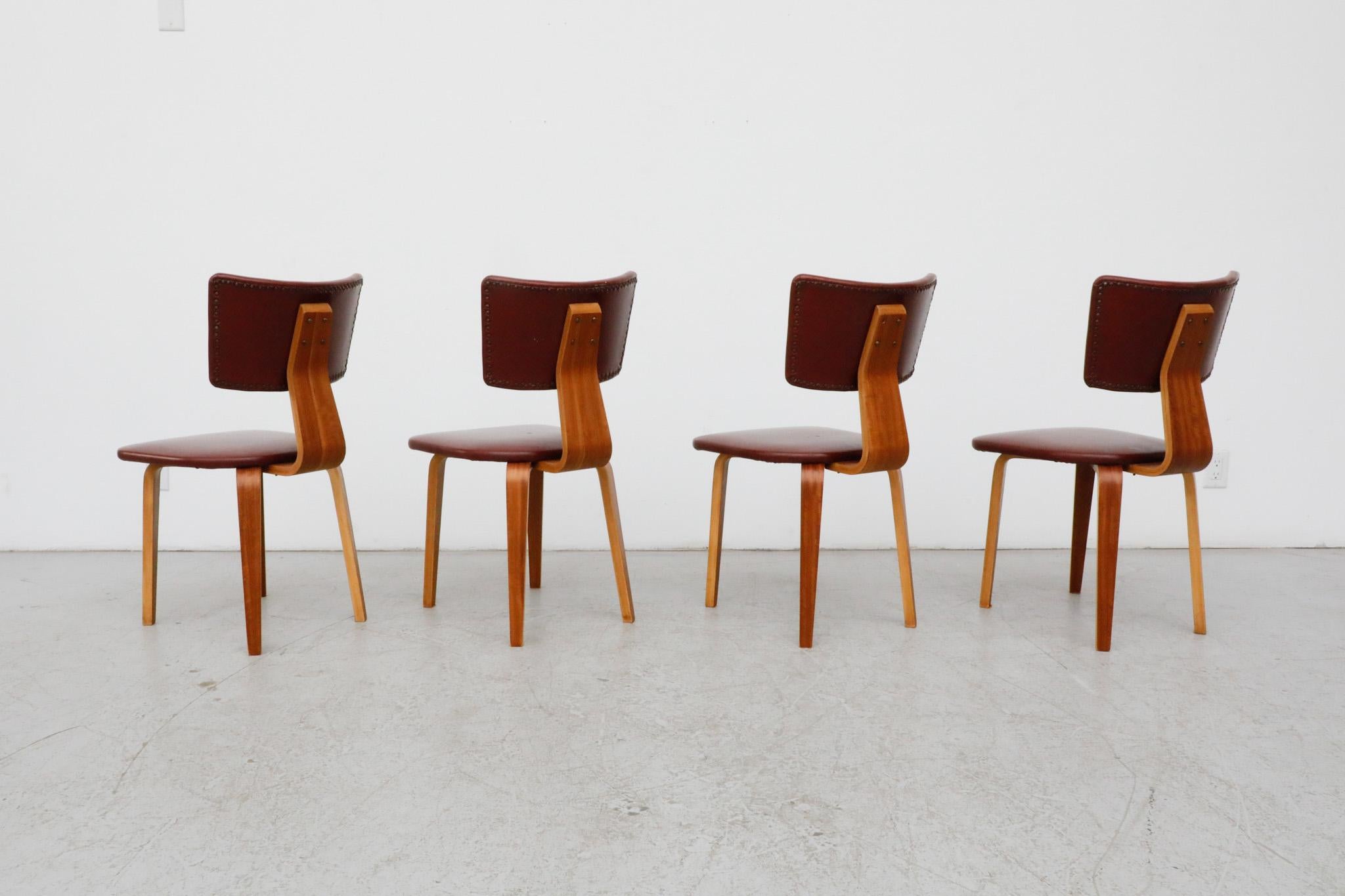 Mid-Century Modern Set of 4 Cor Alons Teak and Burgundy Skai Dining Chairs For Sale