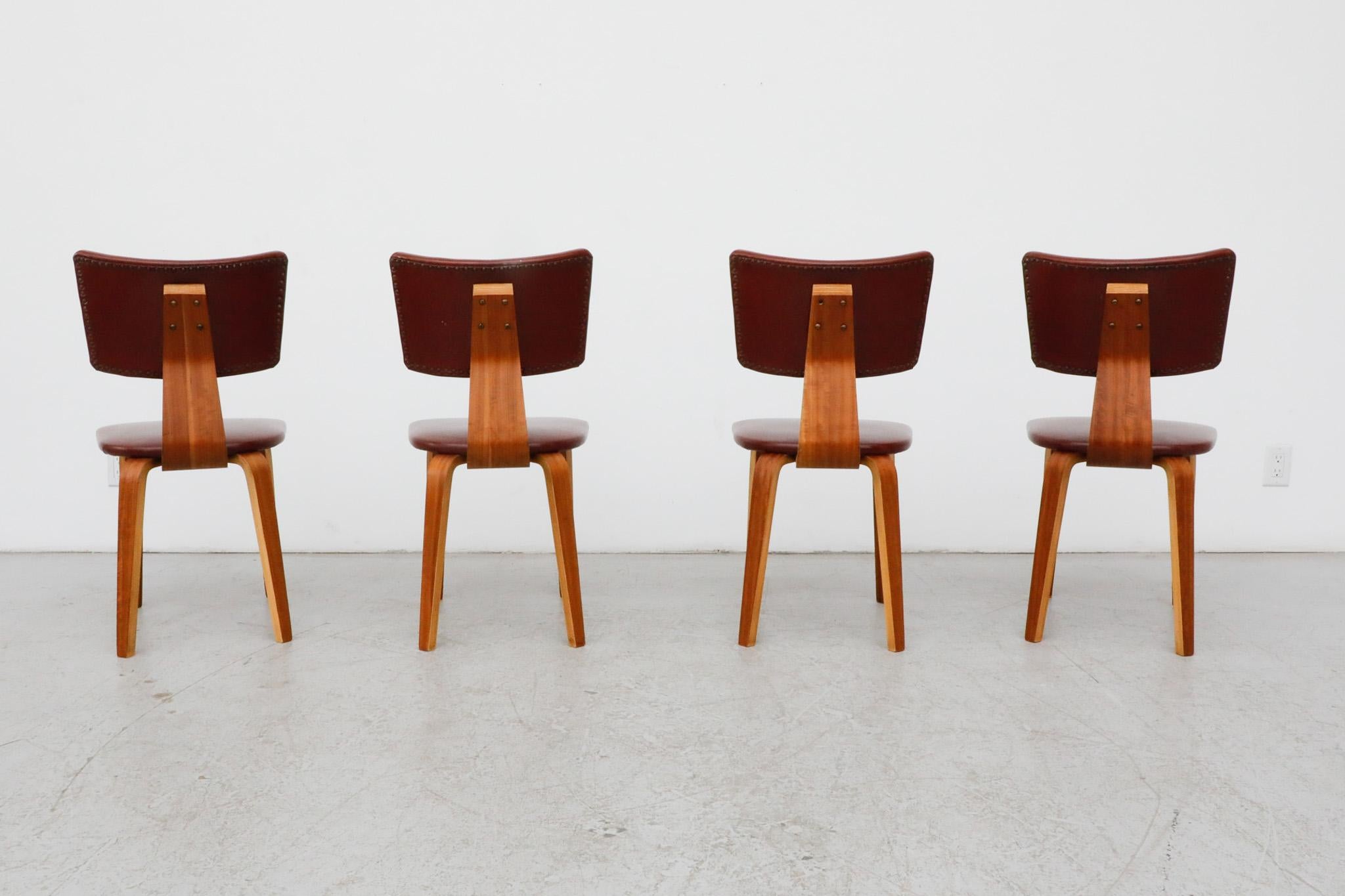 Set of 4 Cor Alons Teak and Burgundy Skai Dining Chairs In Good Condition For Sale In Los Angeles, CA