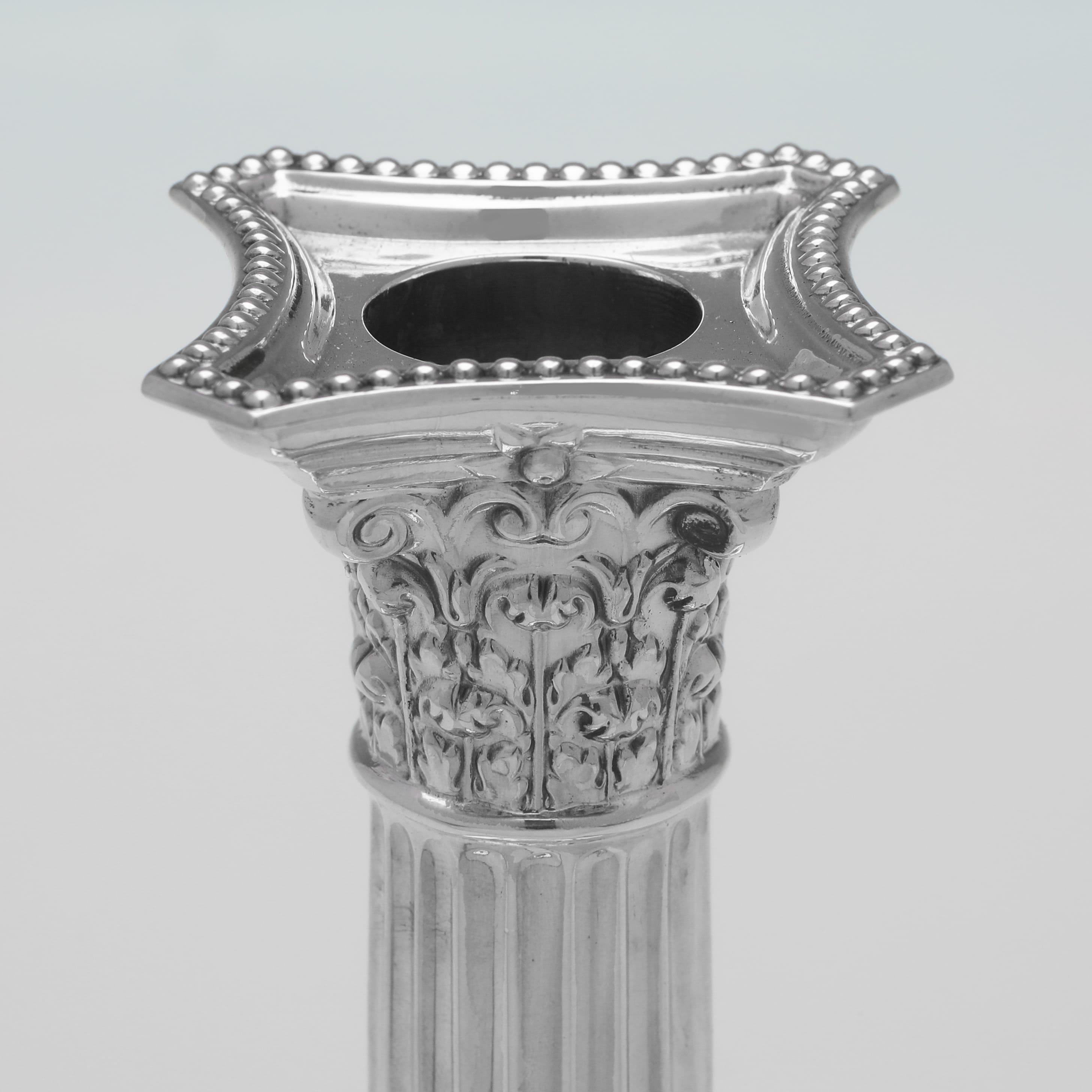 English Set of 4 Corinthian Column Sterling Silver Candlesticks made by Garrard & Co.