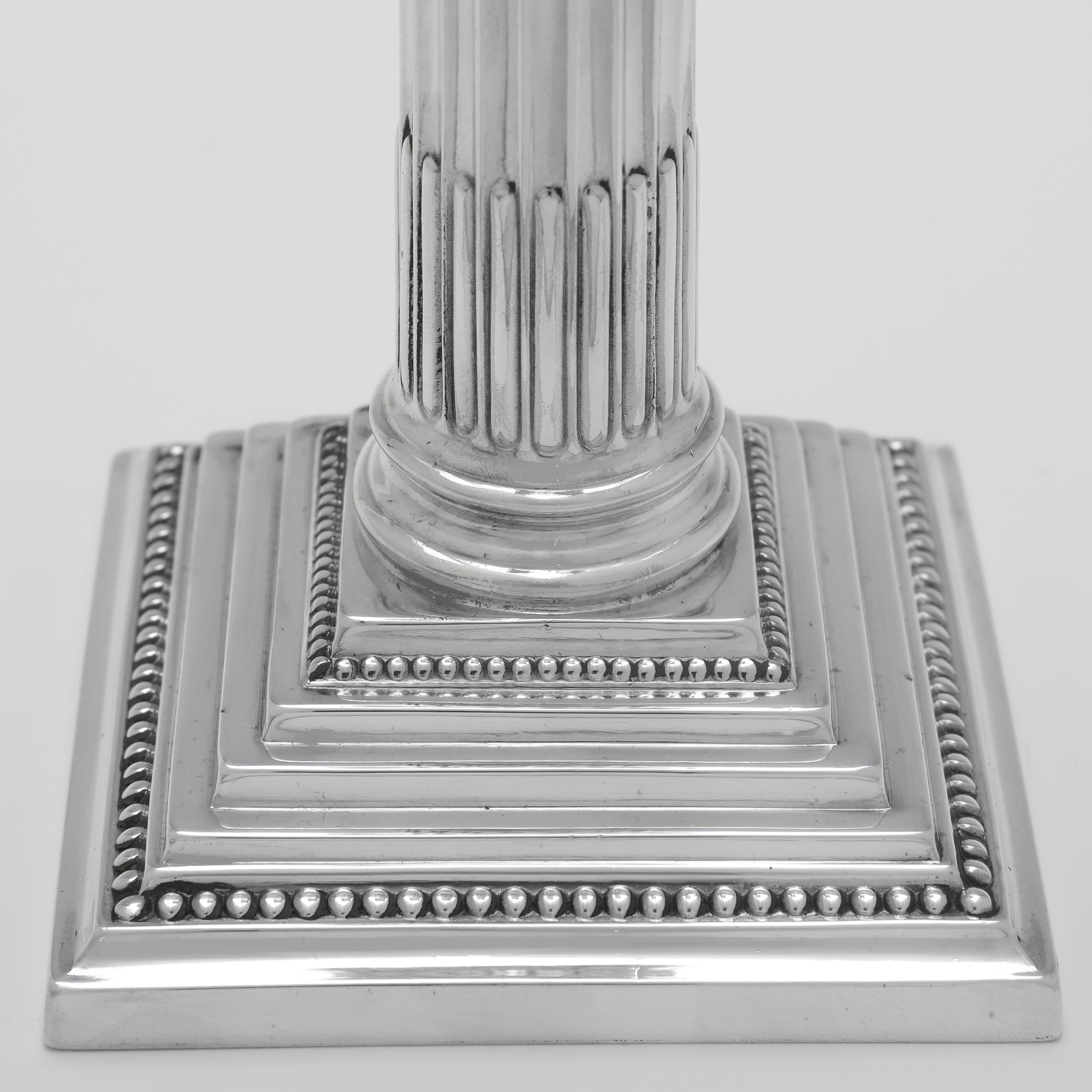 Set of 4 Corinthian Column Sterling Silver Candlesticks made by Garrard & Co. In Good Condition In London, London