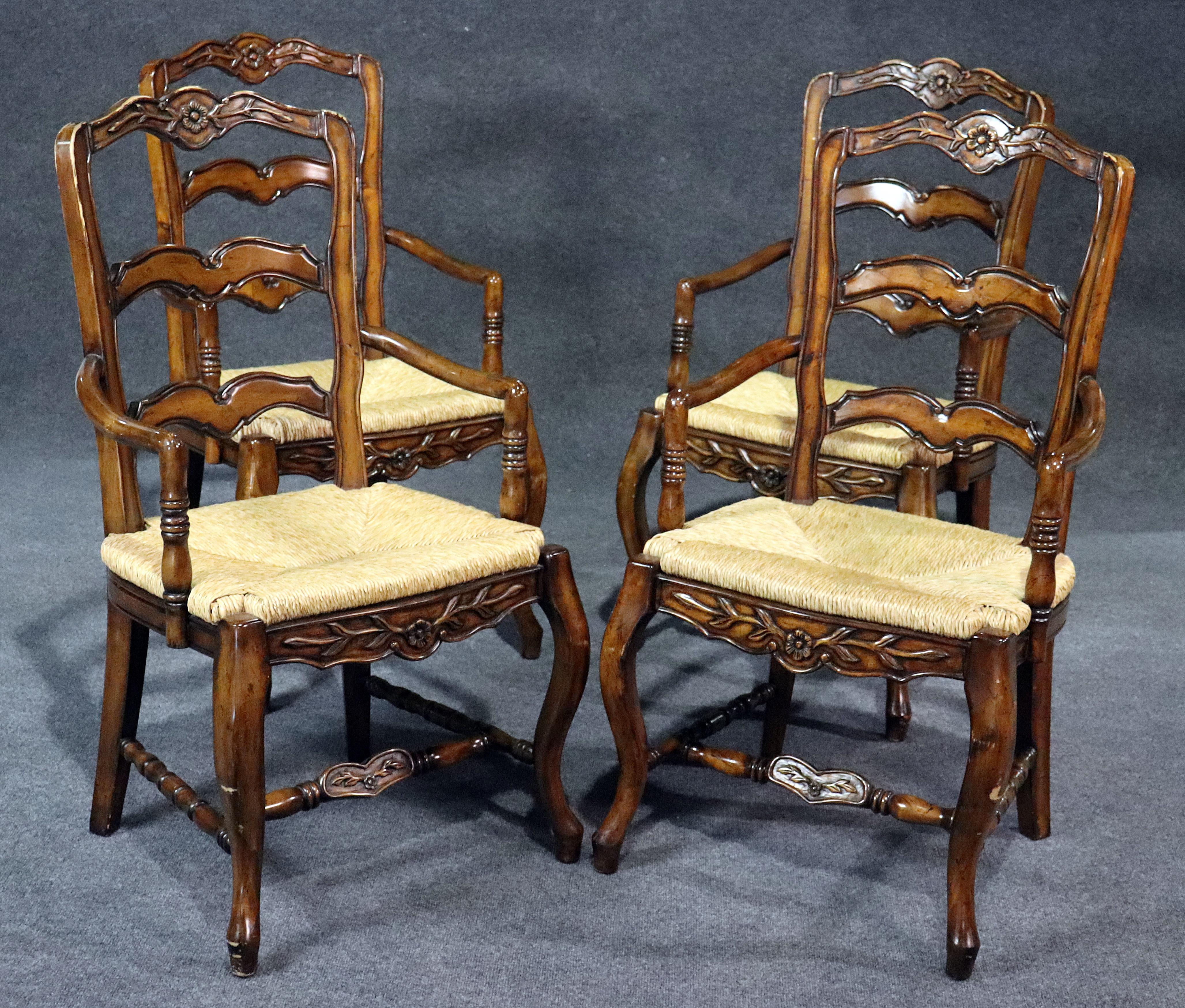 Set of 4 walnut country French style distressed dining room armchairs with rush seats.