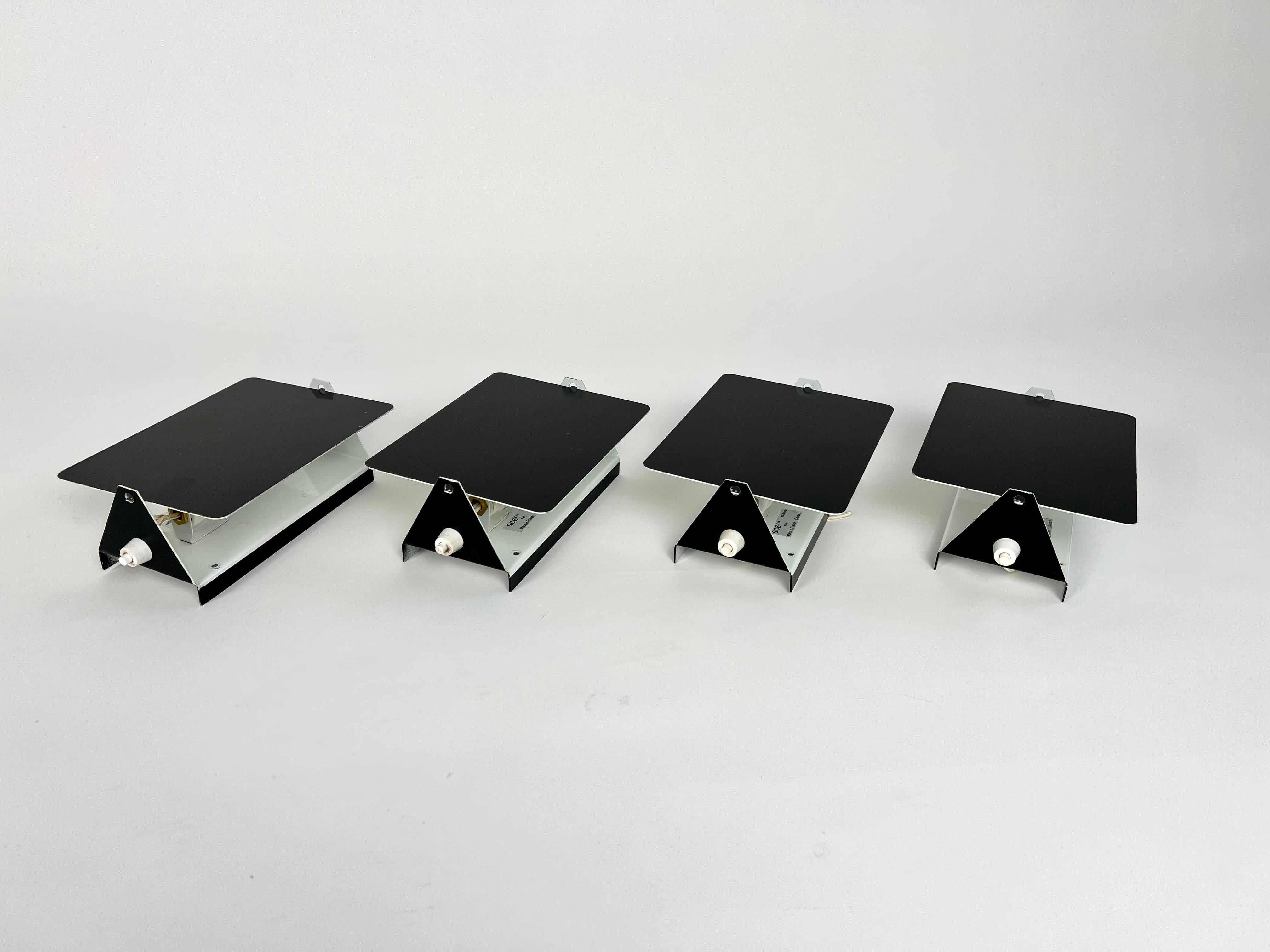 Set of 4 wall lights. 

Model CP1 designed by Charlotte Perriand for Steph Simon.

Sourced from an estate clearance in the Haute Savoie region of France.

These are 1970s editions.

Metal with original paint finish. 

Very good condition, no damage