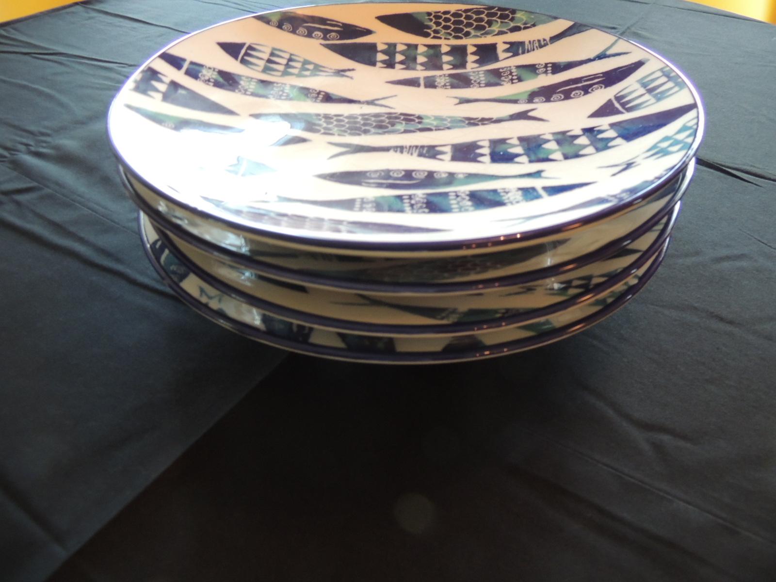 Set of (4) crackle ceramic dinner fish plates
Four round plates with different painted blue and white fish theme.
By. Papart ceramics hand painted in Turkey
Size: 11” D x 1.5” H.
 