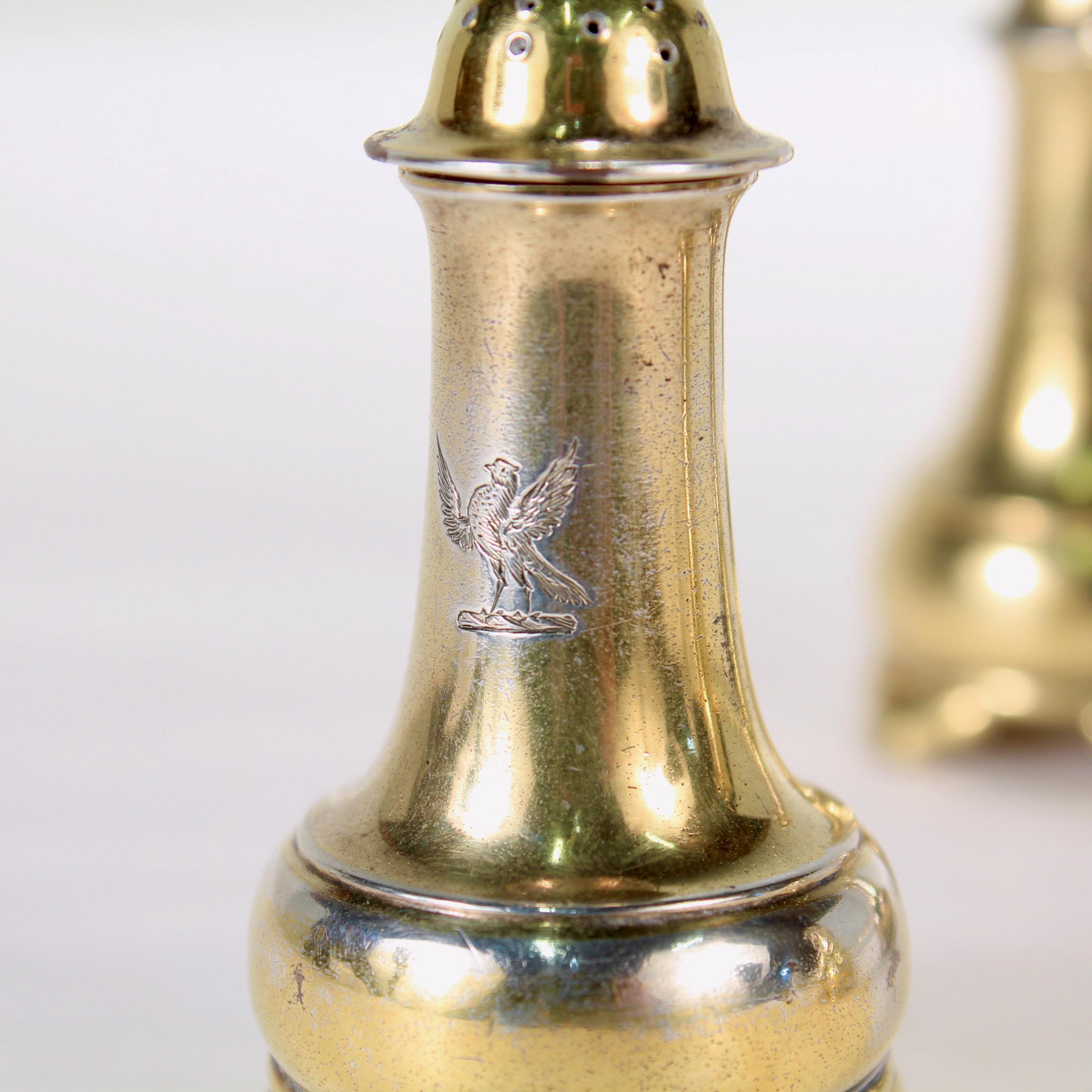 A very fine set of 4 antique gilt sterling silver salt & pepper shakers.

By Tiffany & Co. 

Each shaker is engraved to the center with a Crest of a large bird (which appears to be a hawk or bird of prey).

Simply wonderful salt shakers from Tiffany