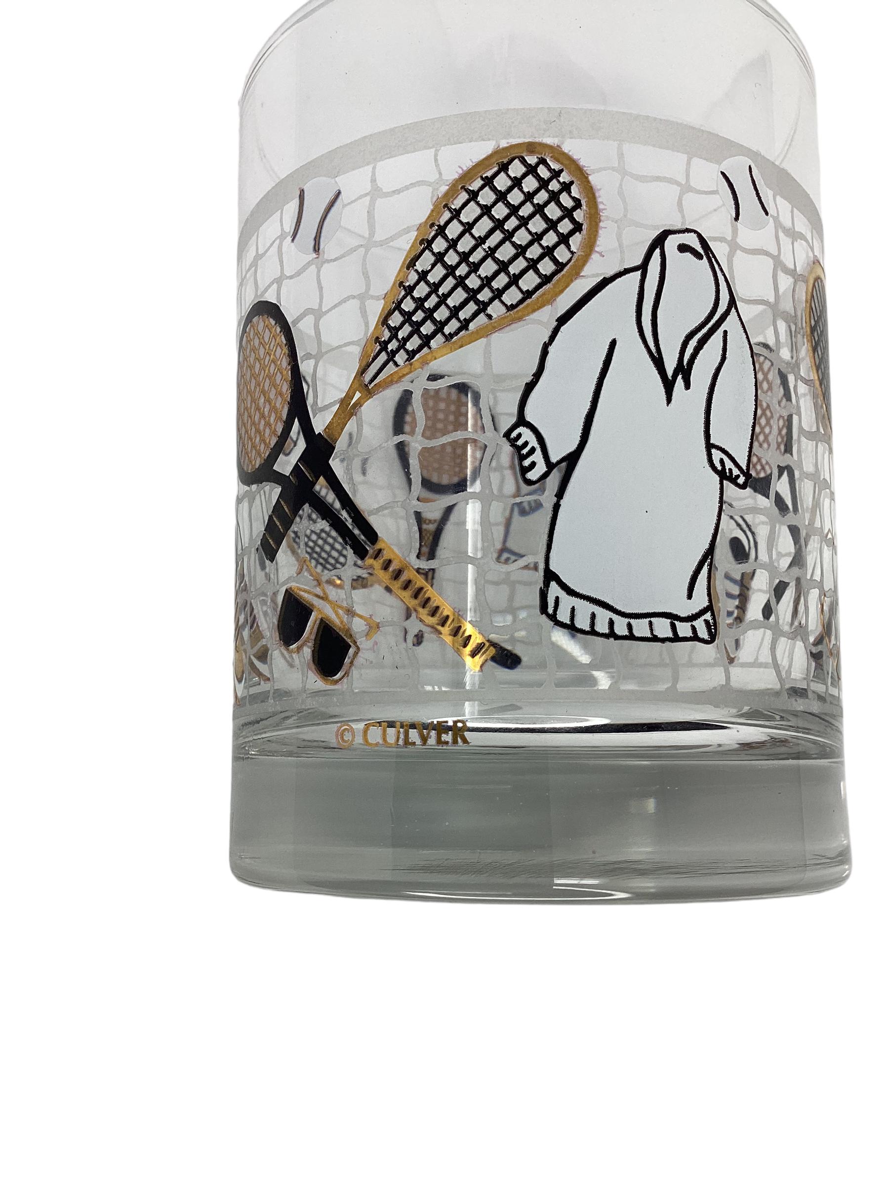 Set of 4 Culver Tennis Rocks Glasses. Decorated with gold and black tennis rackets, tennis shoes, sun glasses, warm up robe and tennis ball super imposed on a tennis net.