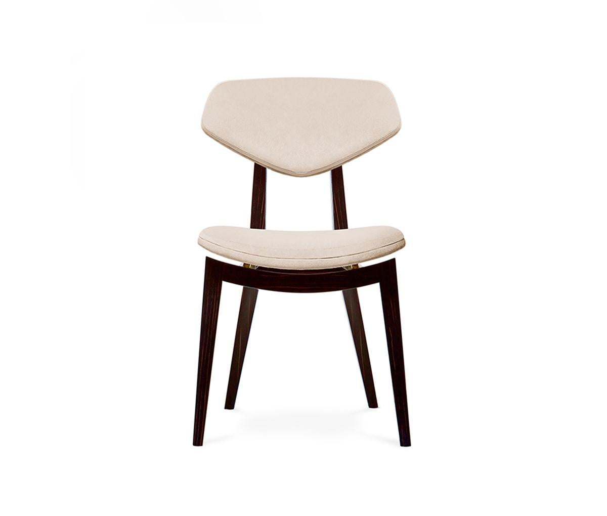 This piece seamlessly combines a retro vibe with contemporary lines, offering both functionality and style. The design features exposed legs that support a wing-shaped padded backrest, providing excellent support and comfort. The platformed seat,
