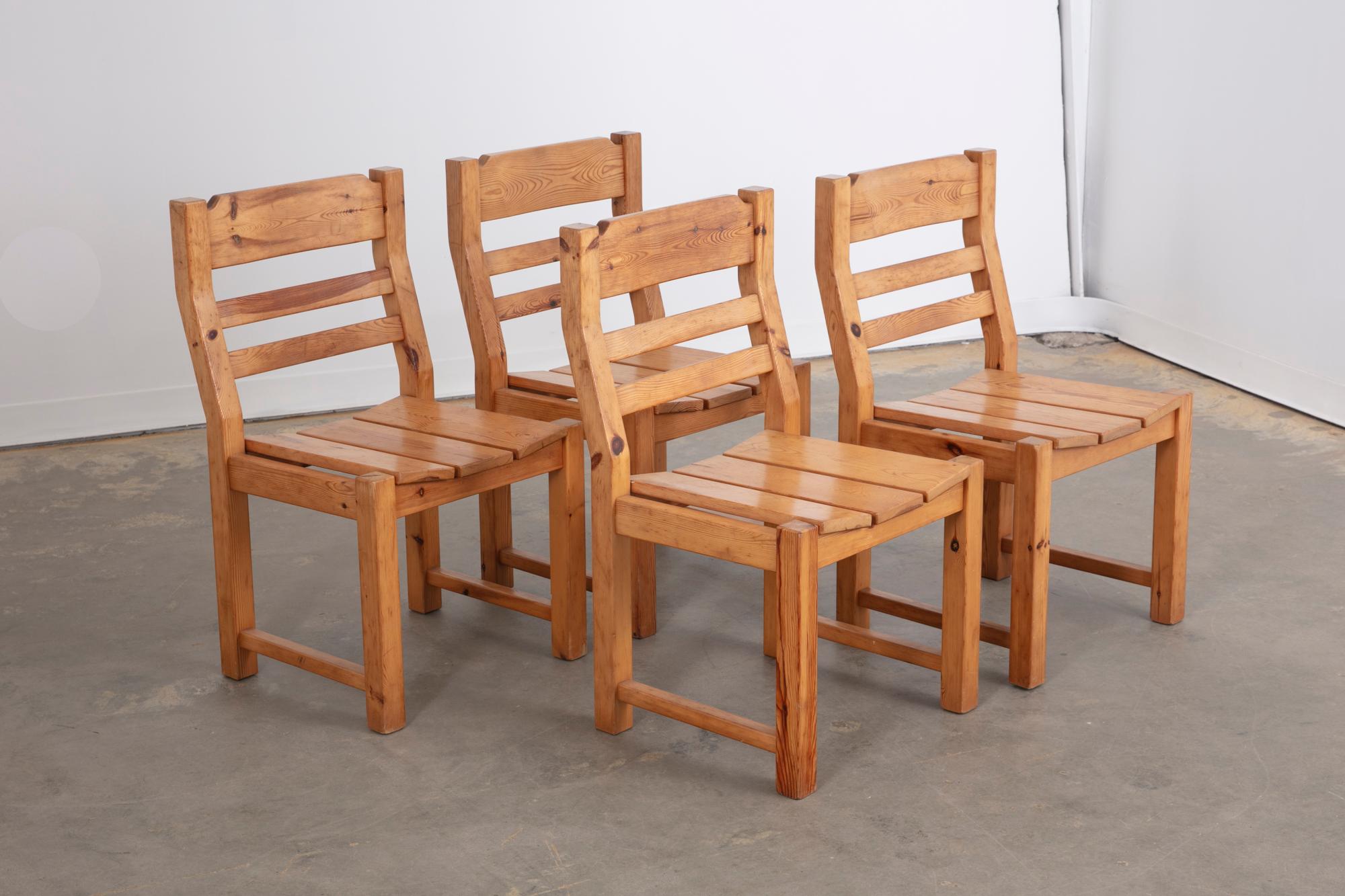 Vintage Danish set of 4 Brutalist dining chairs in old growth pine. Beautiful structural profile and with clean lines and slightly concave seats. 