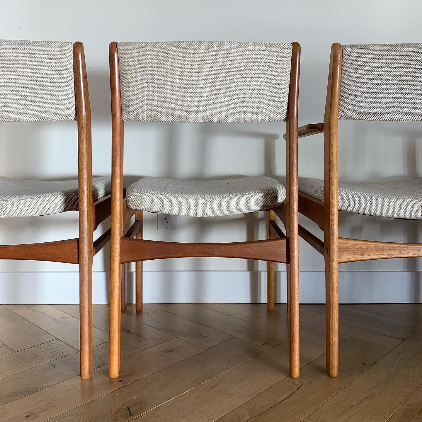 A set of 4 Danish mid-century teak chairs by Ligna, 1960s. Original upholstery is a linen bouclé blend in cream, nutmeg, and ecru. Two with arm rests and two sans. Signs of age include minor scratches and some wear to the upholstery but no glaring