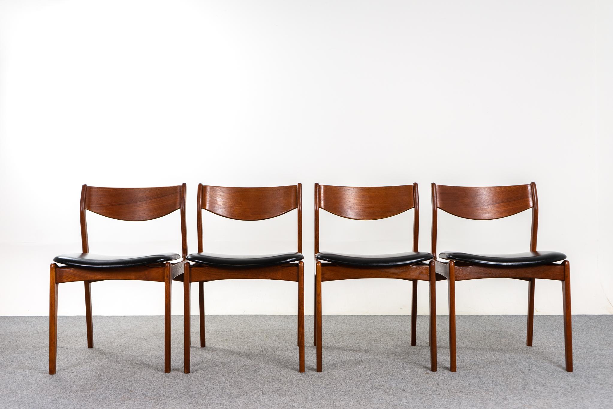 Teak Danish mid-century dining chairs, circa 1960's. Beautifully curved backrests and generous vinyl seat provide support and comfort. Floating seat adds an air of lightness and elegance to the frame, removable seat pad makes reupholstery a