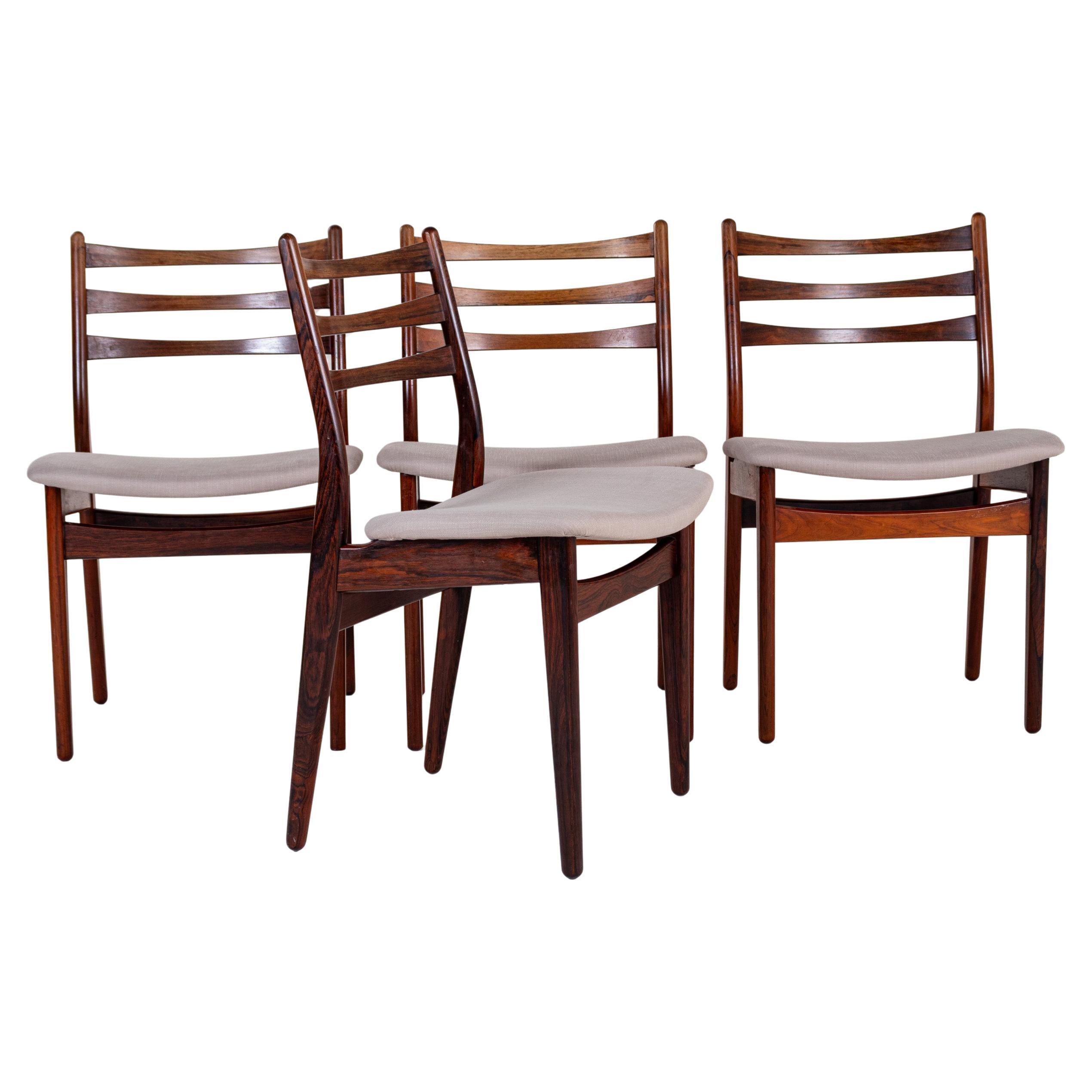 Juego de 4 sillas de comedor danesas de palisandro de mediados de siglo en venta