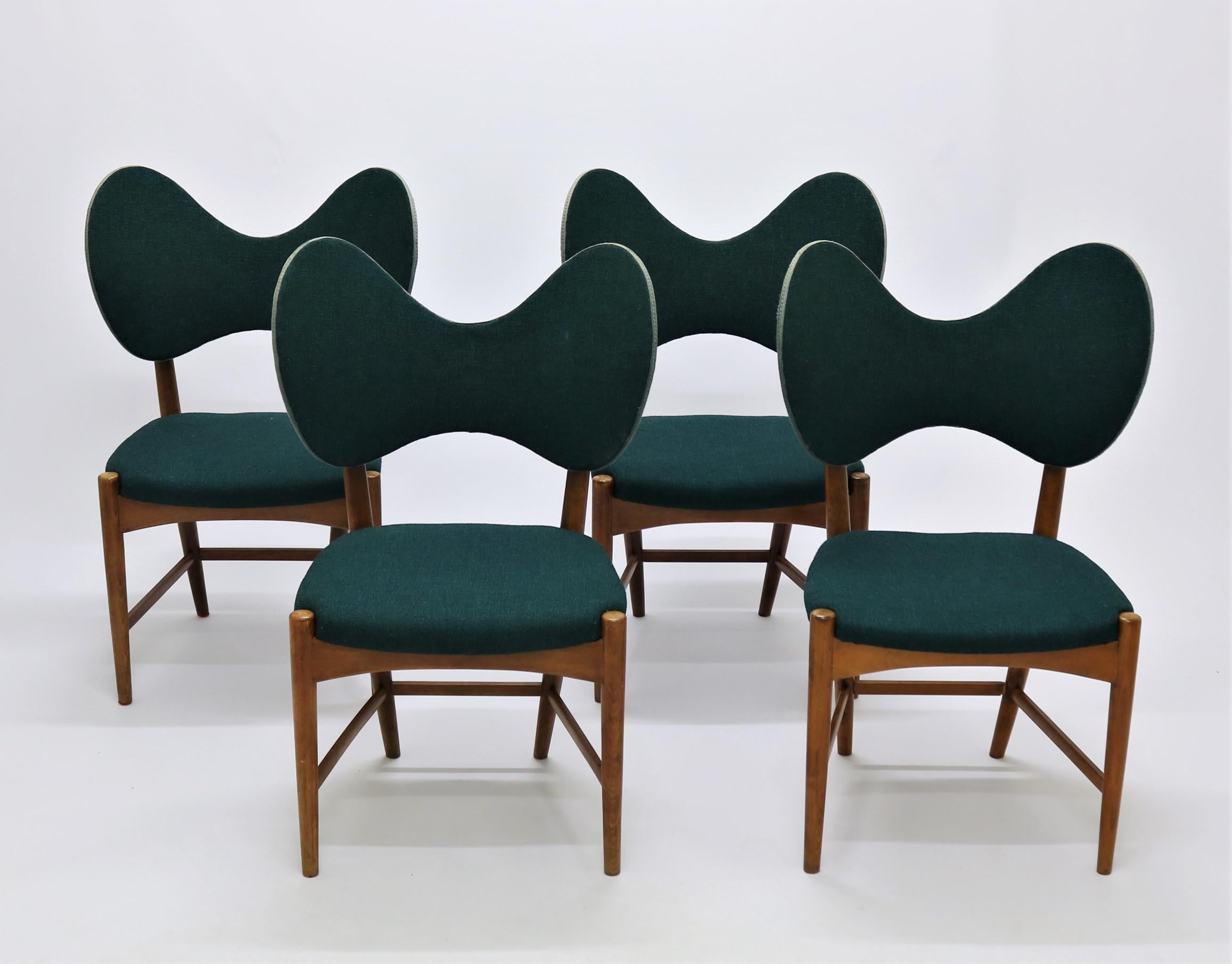 Gorgeous set of very rare Danish design from the early 1950s by designers Eva & Nils Koppel. Made and manufactured in Denmark by Møbelfabrikken Norden. The chairs are made of stained and lacquered beech and the original beautiful blue/turquoise wool
