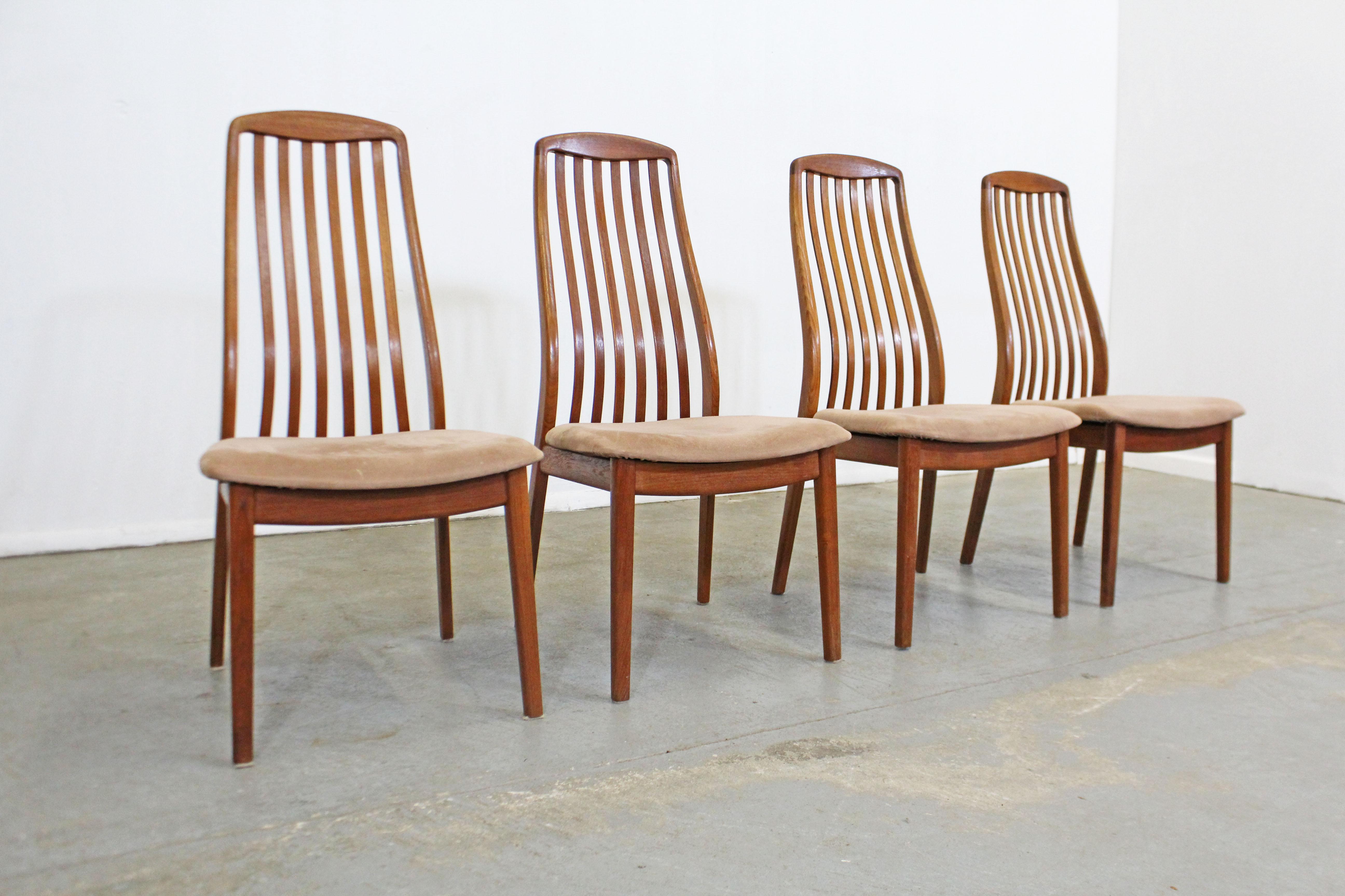 What a find. Offered is a Danish modern set of 4 teak dining chairs. Includes 4 teak side chairs with spindled backs and upholstered seats by Schou Andersen of Denmark. They are in good vintage condition, showing slight age wear (surface scratches,