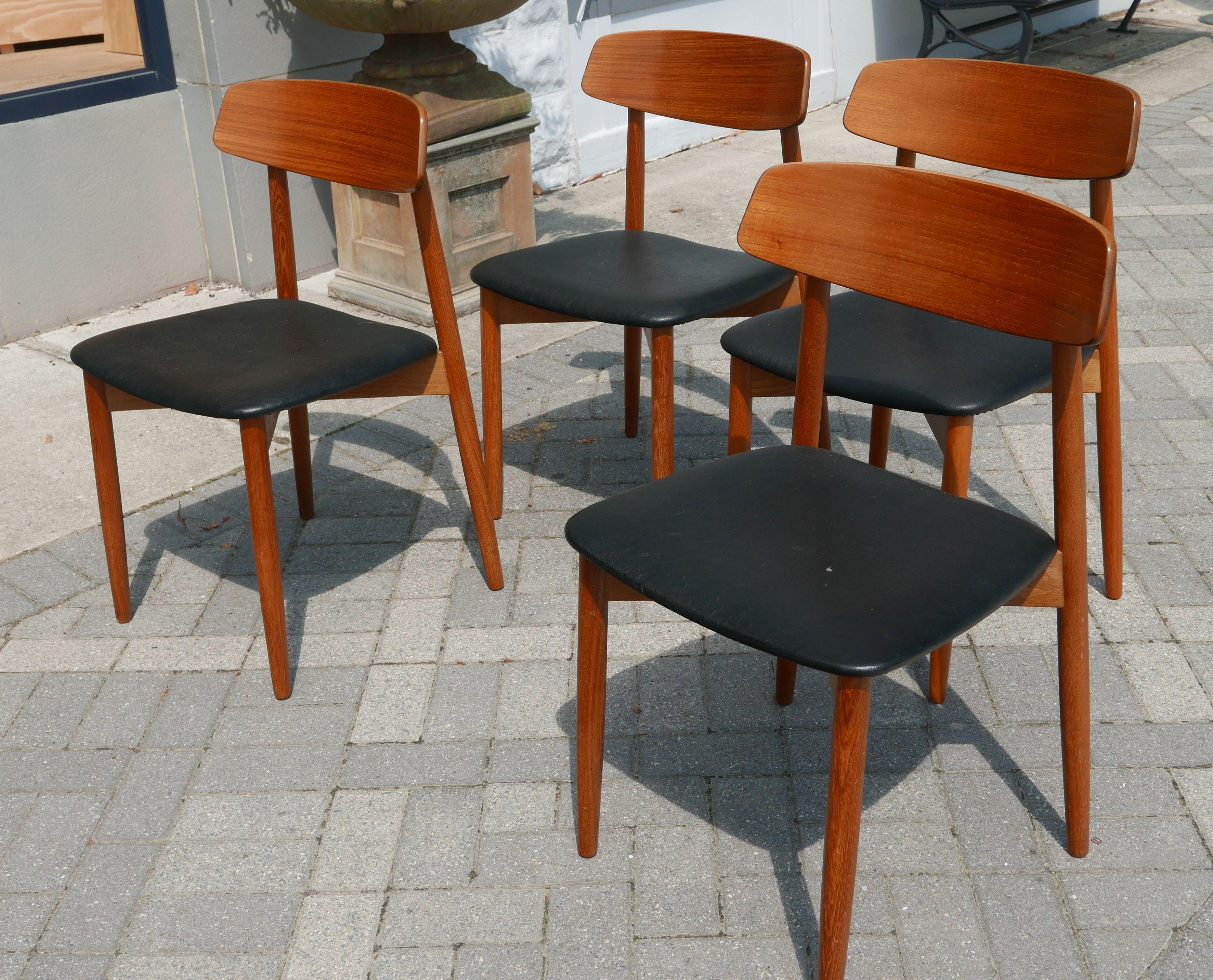 An almost new looking set of Danish modern teak chairs by Harry Østergaard for Randers. Spectacular construction and a wonderful simplicity to the design. Original upholstery in excellent condition.