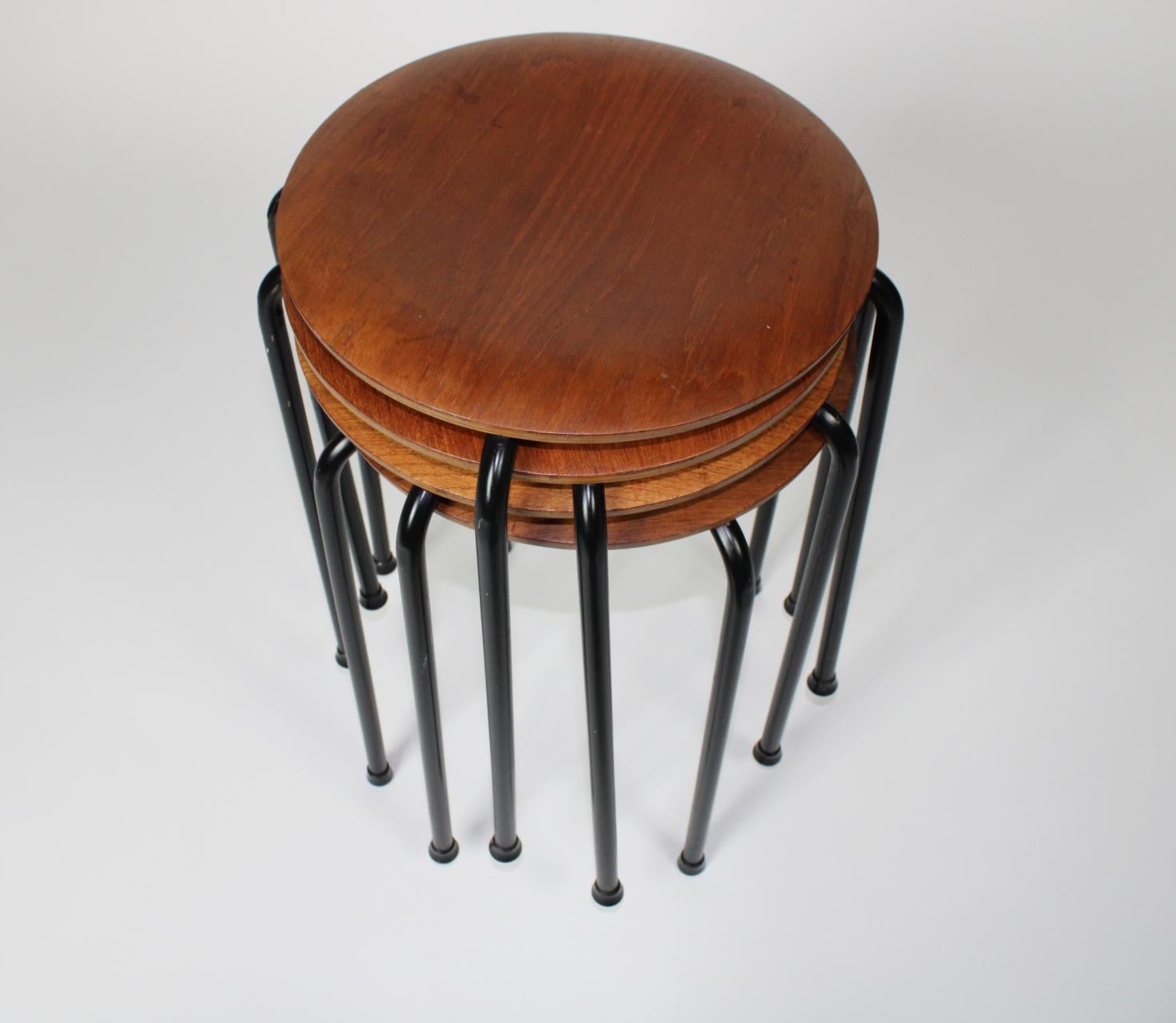 Set of 4 teak and steel stacking stools in the manner of Arne Jacobsen design.
Marked 