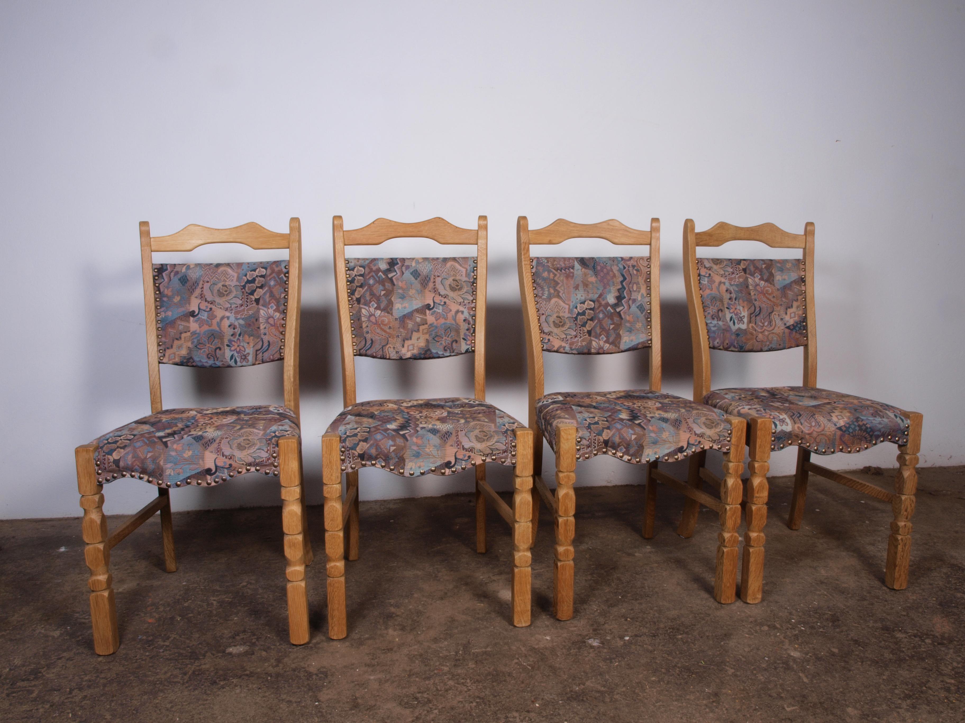 A set of 4 beautiful and well kept oak dining chairs from Denmark 1960s. They are made of solid Oak wood in the style of Henning Kjærnulf. They are all solid and firm, and the fabric is in very good condition with no stains or smell.

More pictures