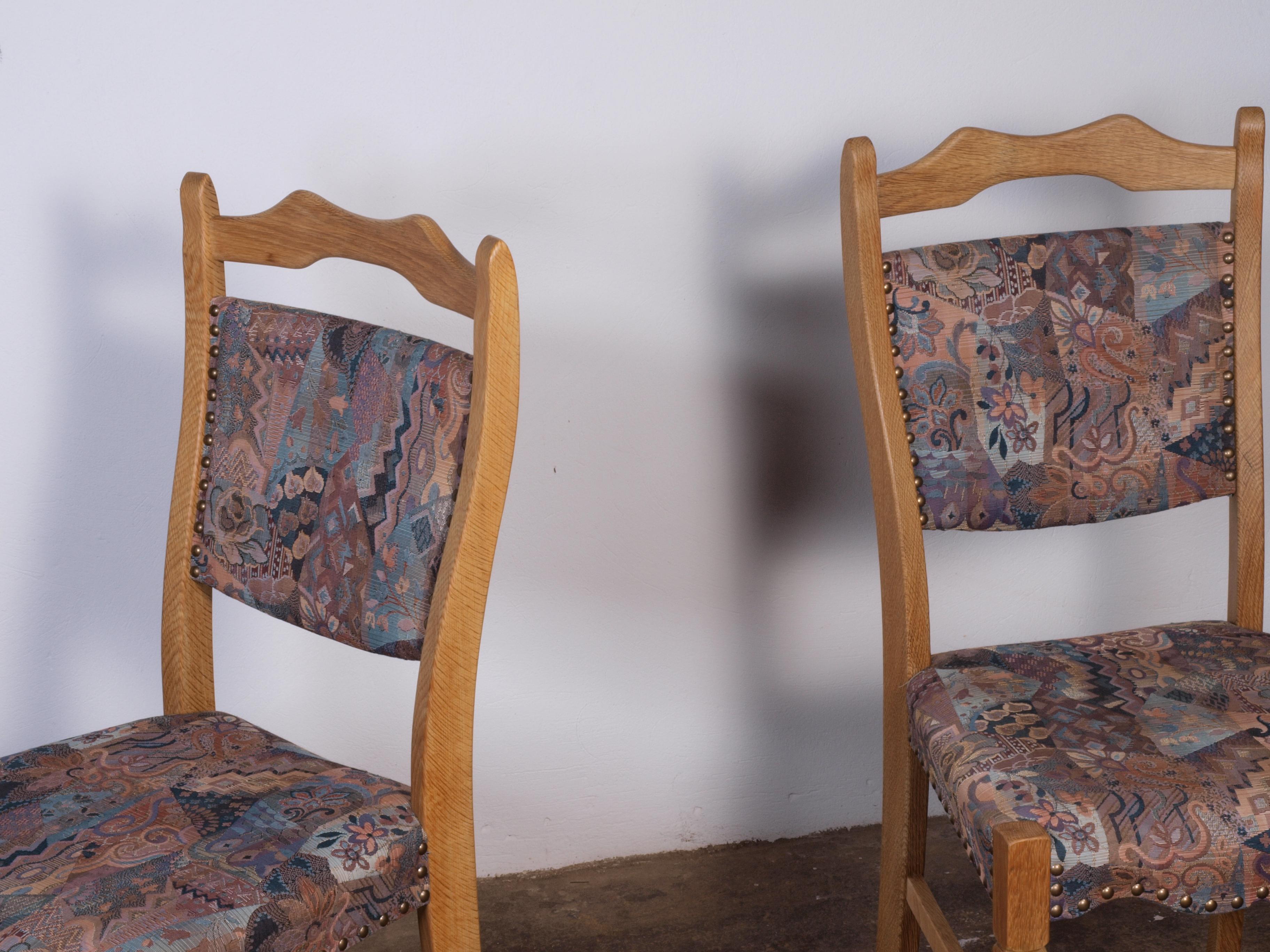 Mid-20th Century set of 4 Danish Oak Dining Chairs attributed to Henning Kjærnulf For Sale