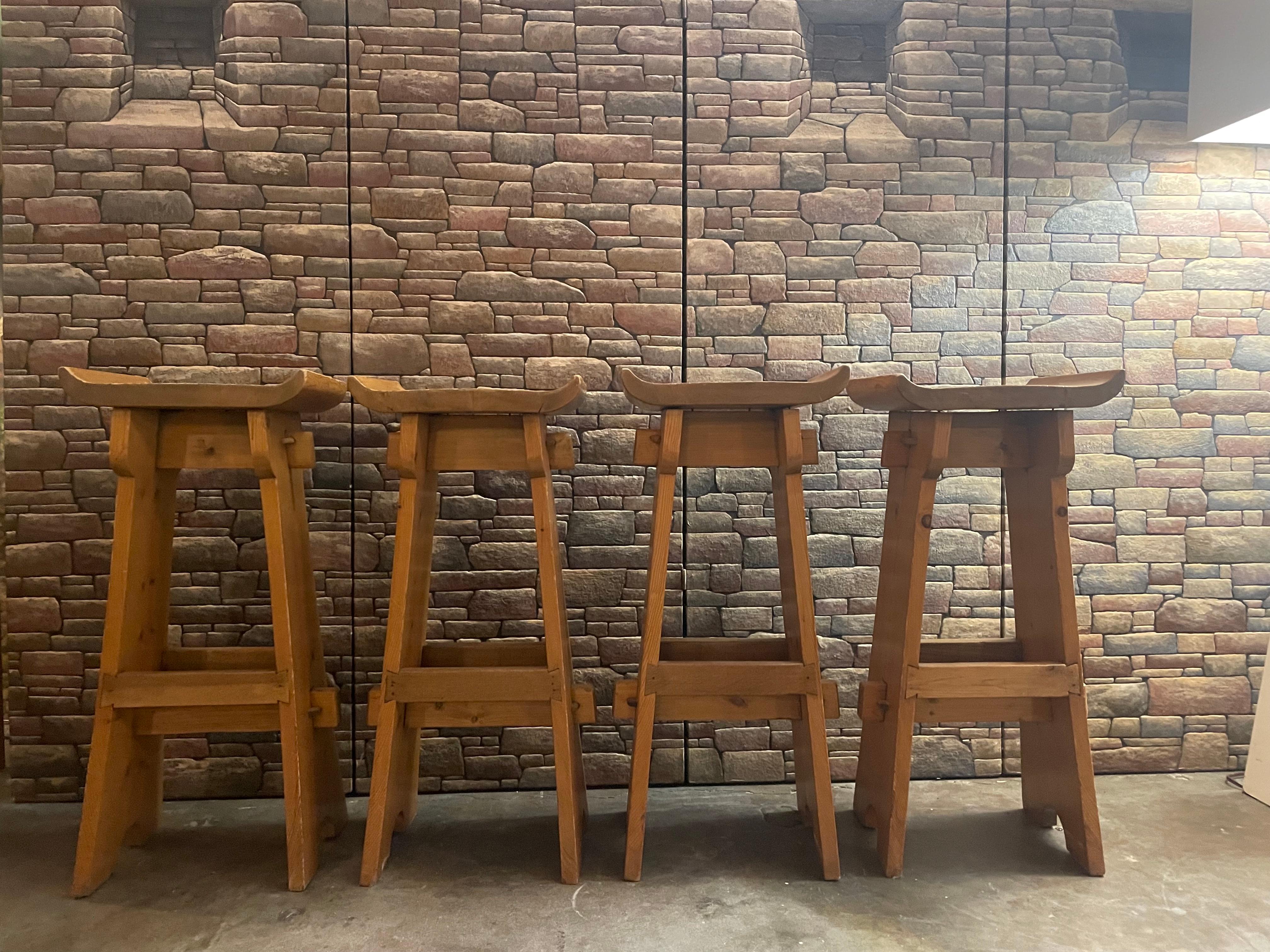 Set of 4 Danish pine brutalist bar stools, circa 1970s. Traces of age-appropriate wear and in good condition. 
Dimensions: 13.75