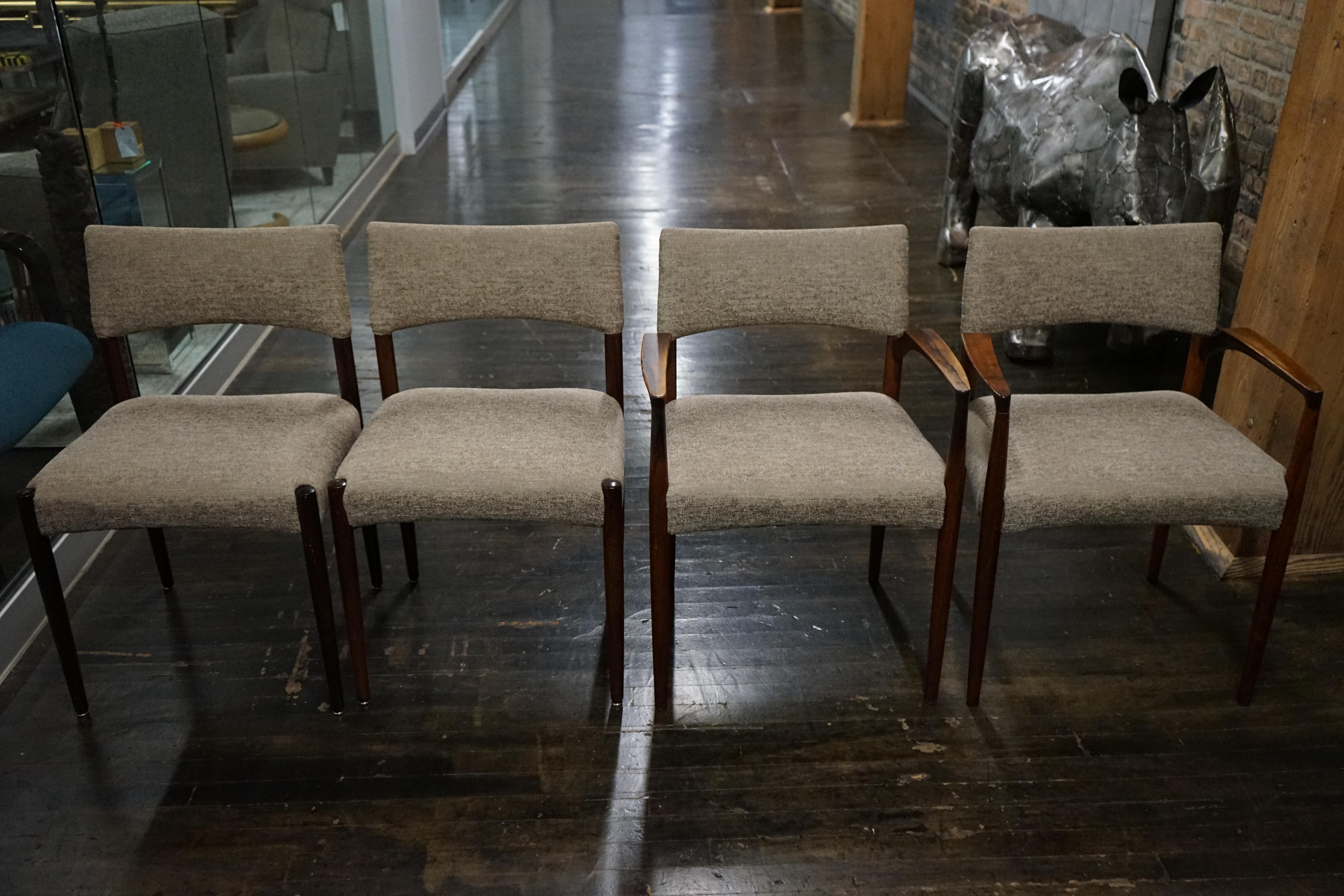 Set of 4 Danish Modern rosewood dining chairs attributed to Aksel Bender and made by Willy Beck in Copenhagen. These chairs have a beautiful shape.  Set includes 2 armchairs and 2 side chairs. 

Upholstery is in shades of cream and light browns.